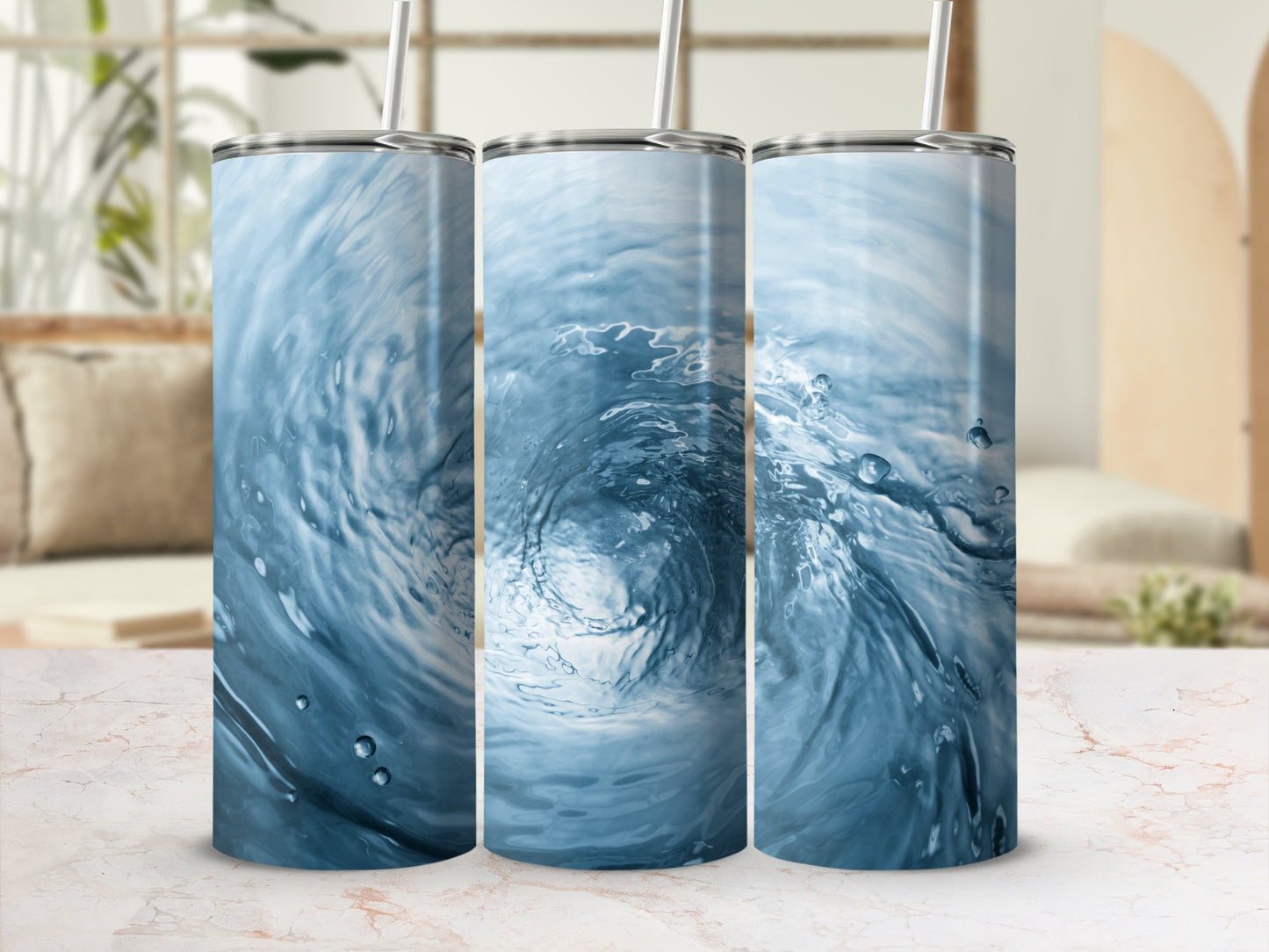 Three tumblers with a swirling blue water design.