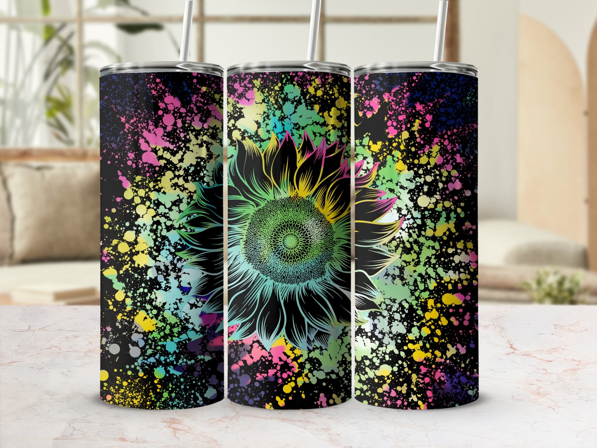 Three tumblers featuring a neon sunflower design with colorful paint splatters on black.