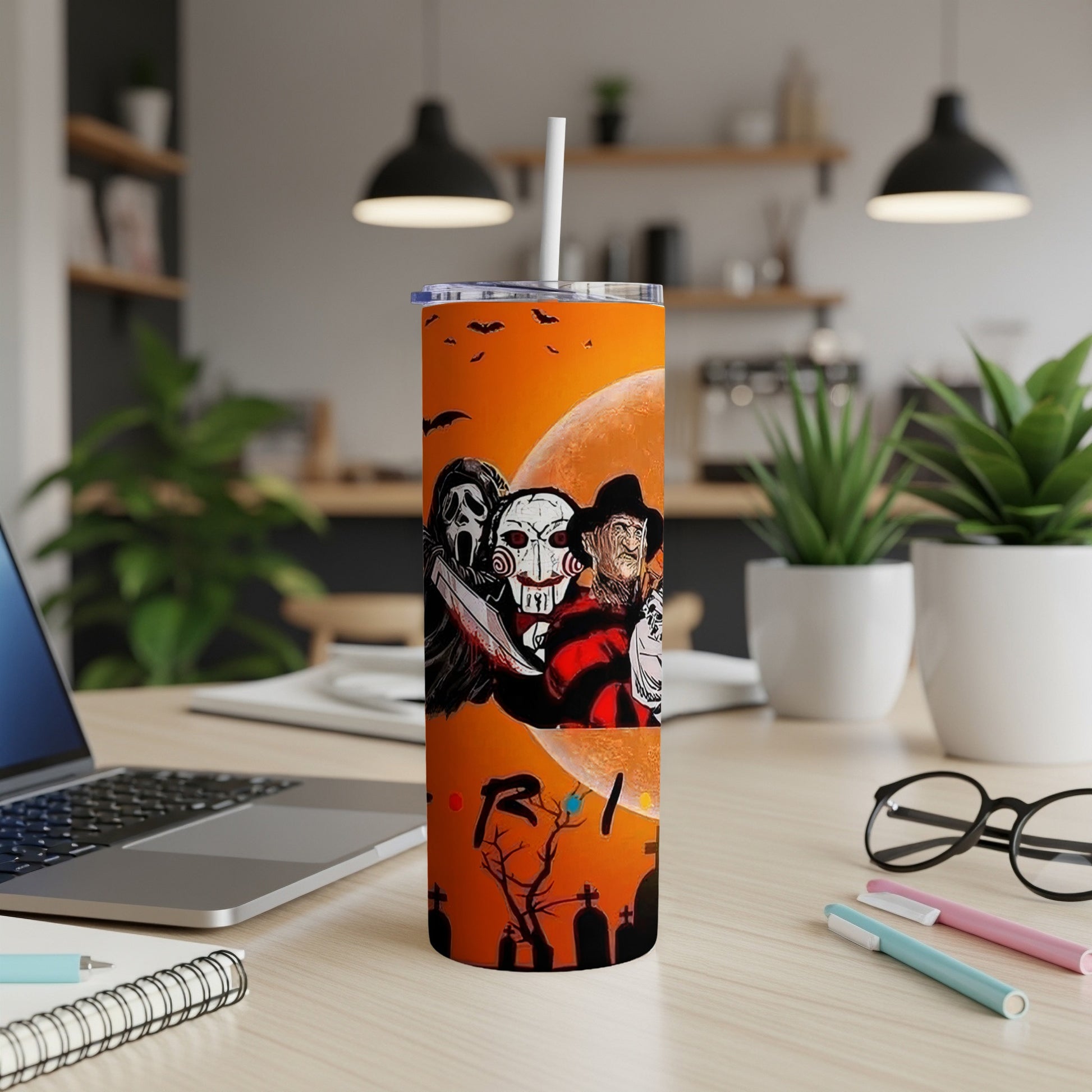 Halloween tumbler with Freddy, Michael Myers, Ghostface, and a tombstone.