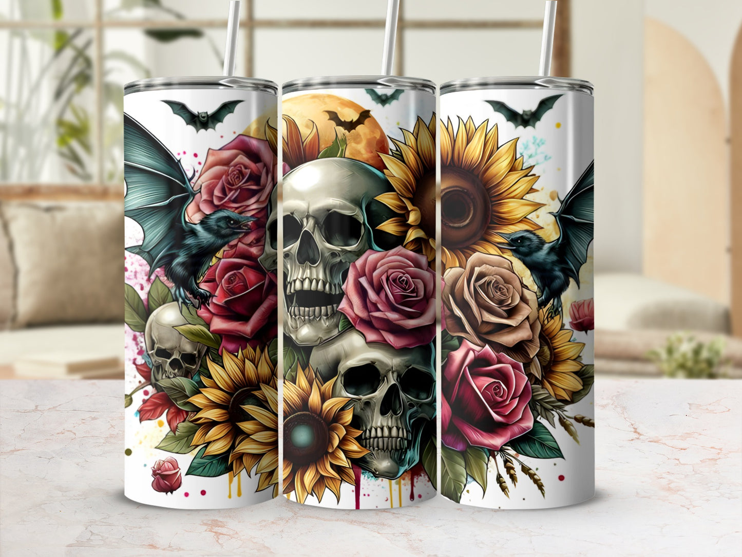 Three Halloween-themed tumblers with skulls, bats, roses, and sunflowers.