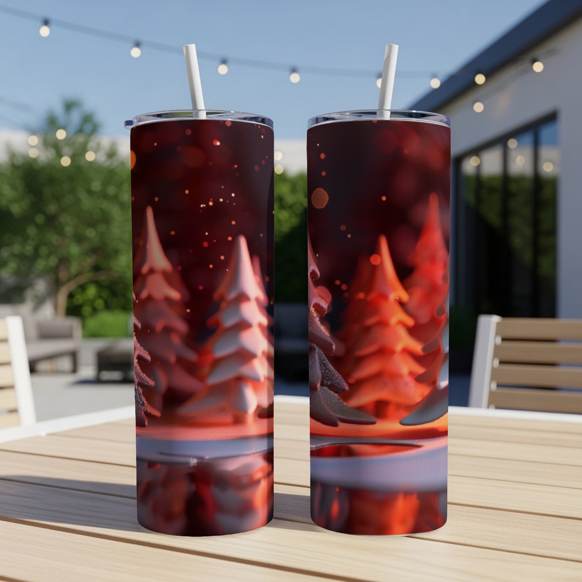 Two tumblers with frosted Christmas trees and bokeh background.