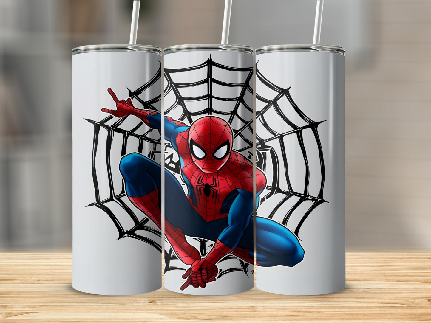Spiderman in web against white background on three tumblers.