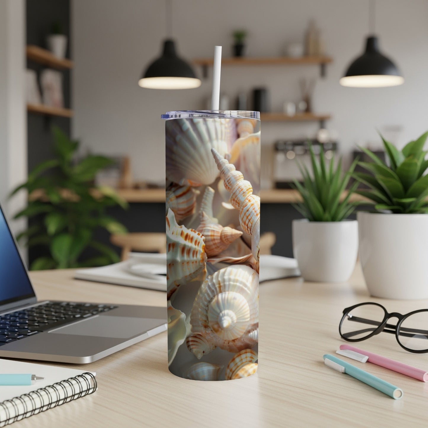 Tumbler with a close-up view of various seashells.