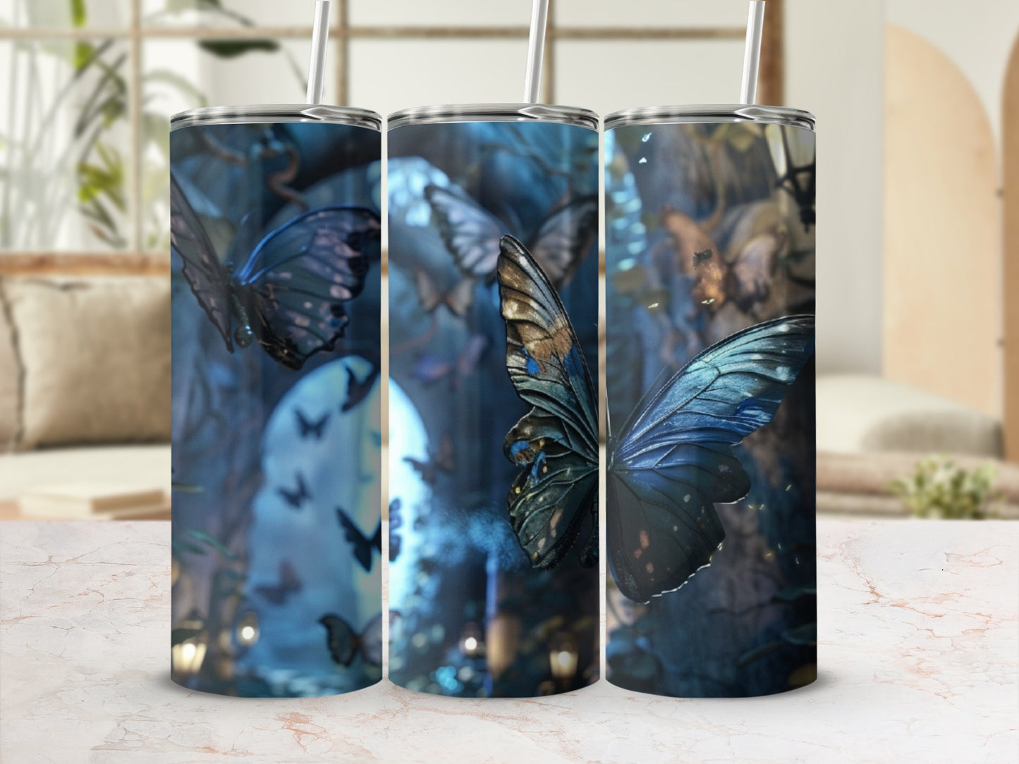 Dark blue and teal butterfly art on a skinny tumbler.