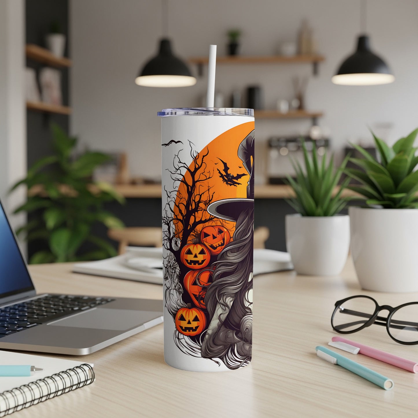 White tumbler with Halloween witch, pumpkins, bats, and spooky tree design.