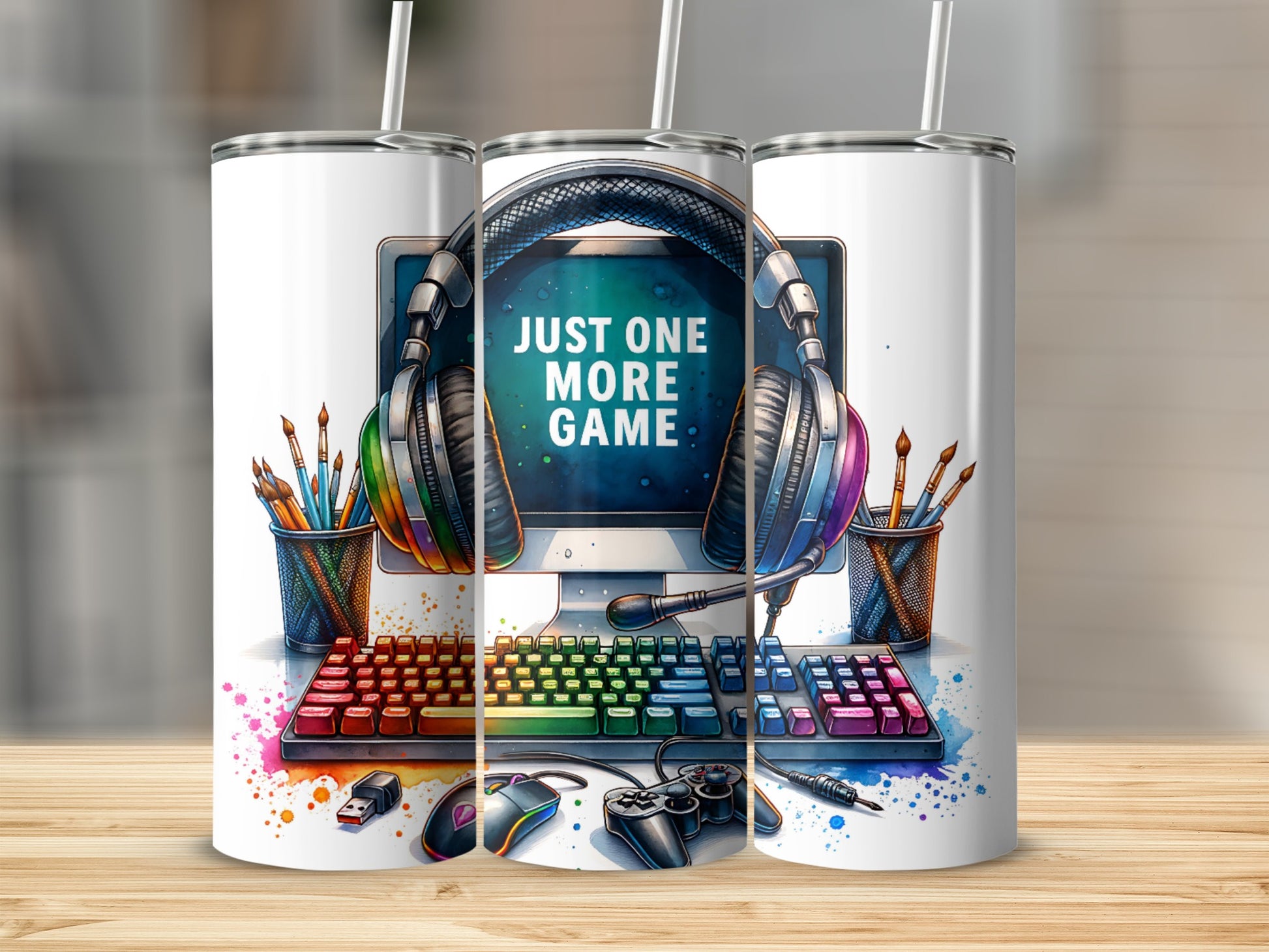 Computer setup with headphones, keyboard, mouse, and controller, text "JUST ONE MORE GAME".