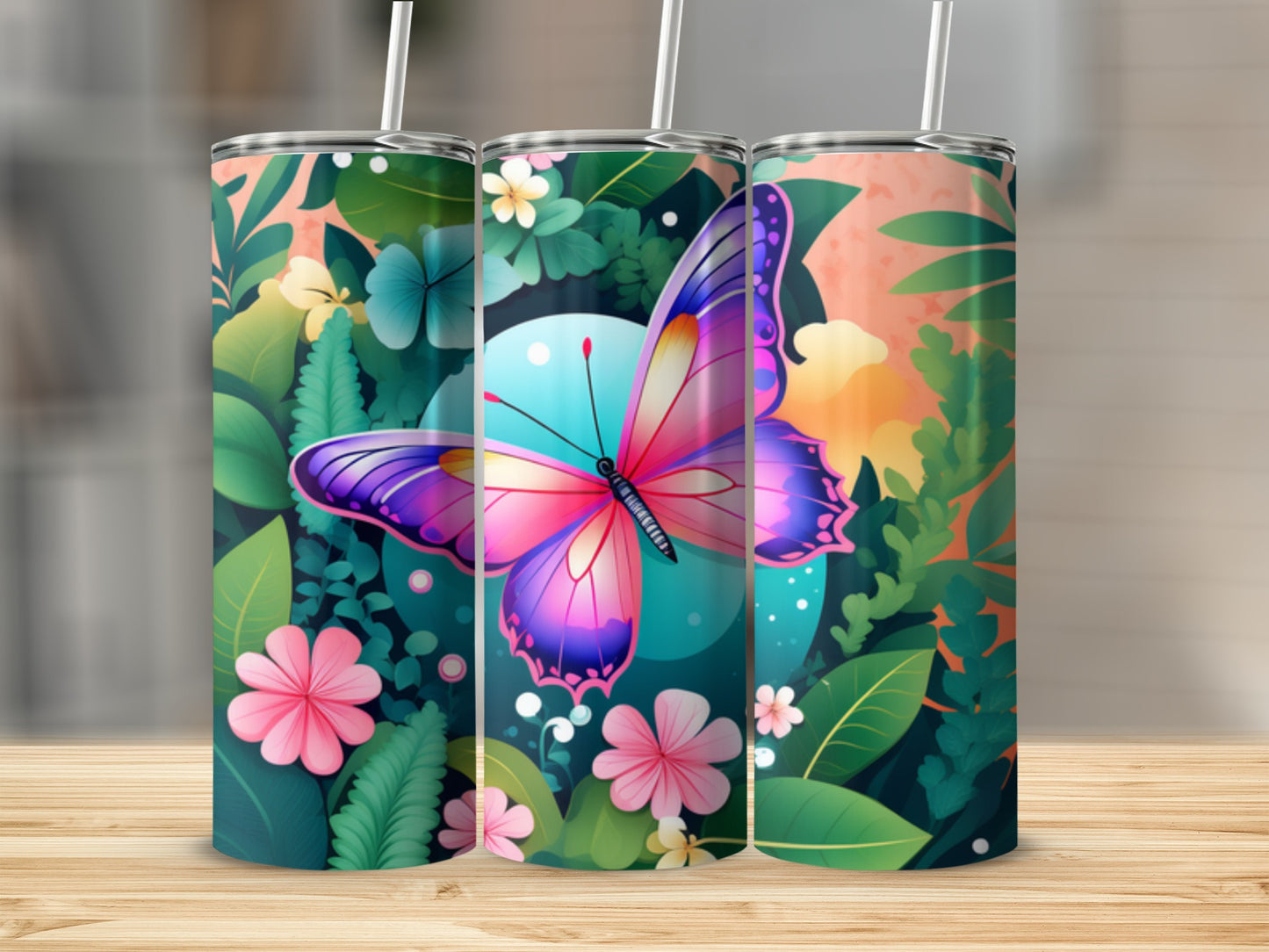 Three tumblers with vibrant butterfly and floral designs.