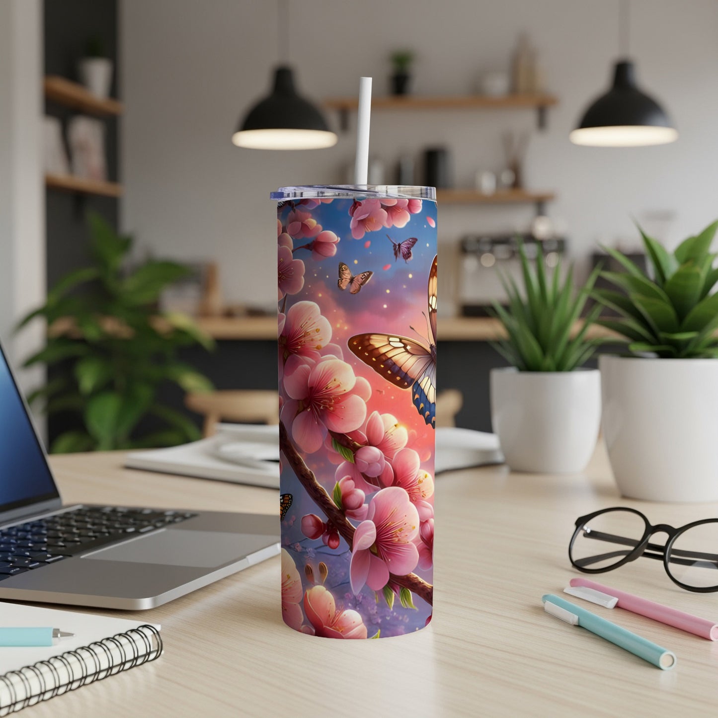 Butterfly on cherry blossoms, on a stainless steel tumbler with straw.