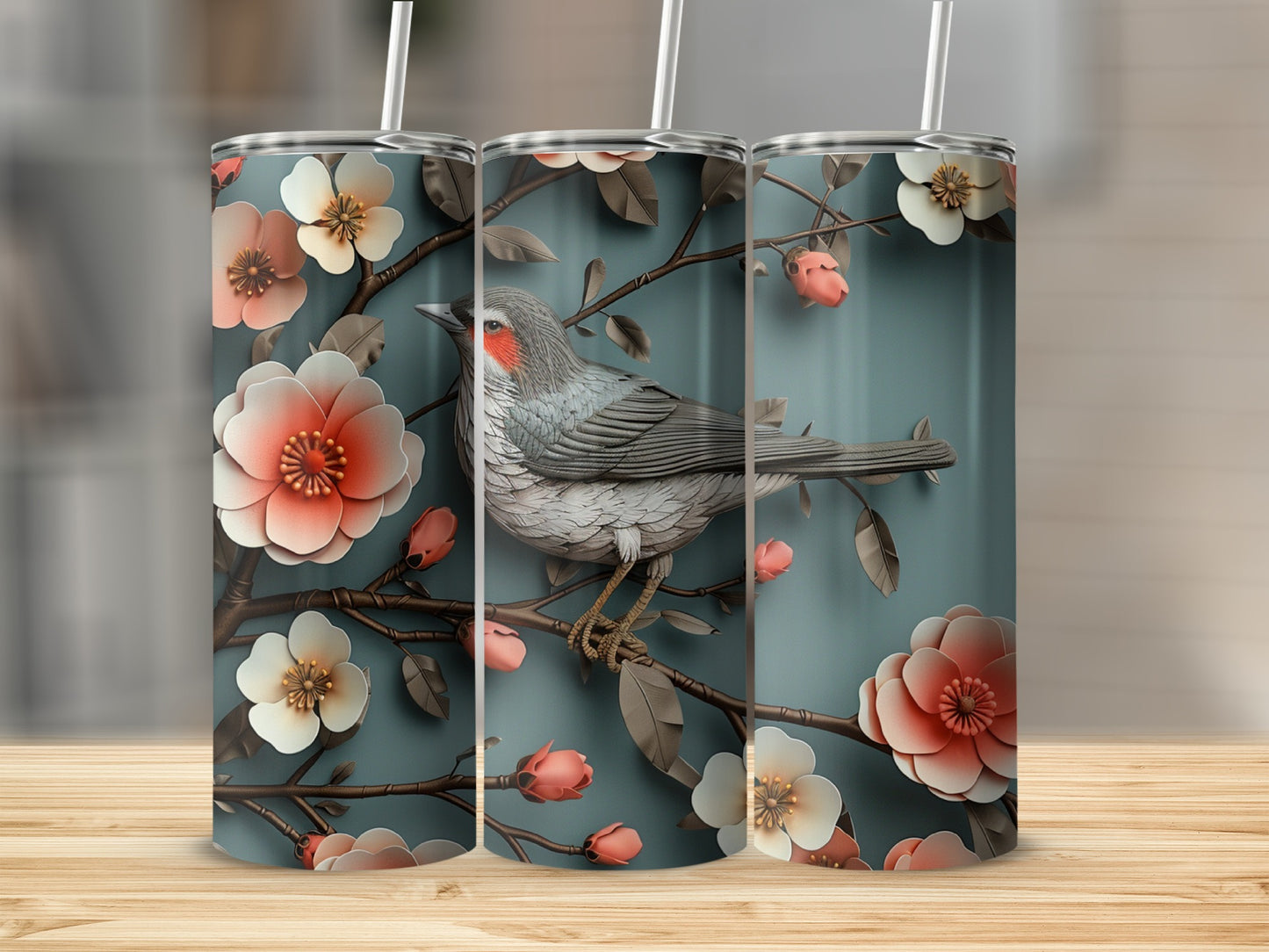 Three tumblers with a gray bird on a floral branch.
