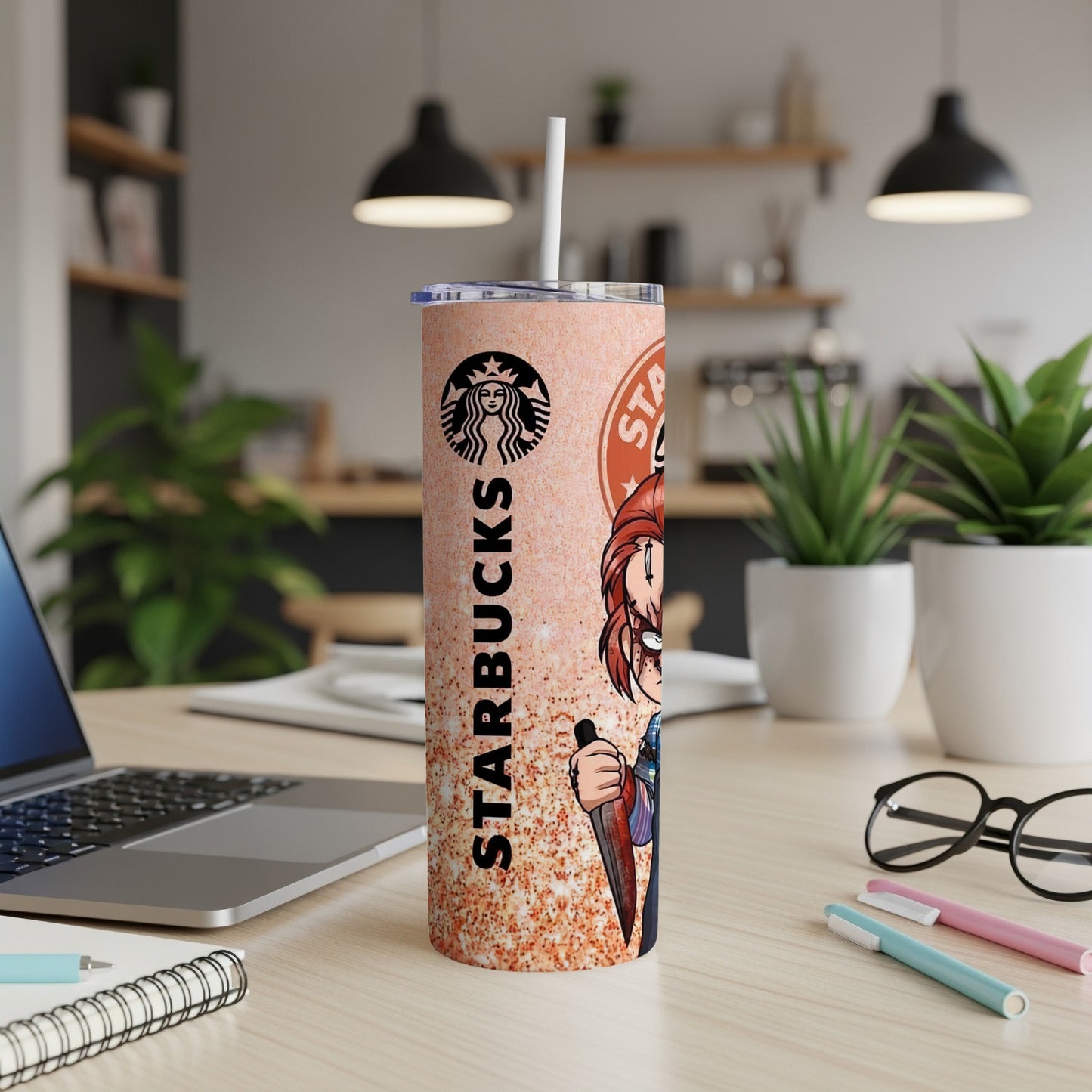 Starbucks tumbler with Chucky from Child's Play design, white straw.