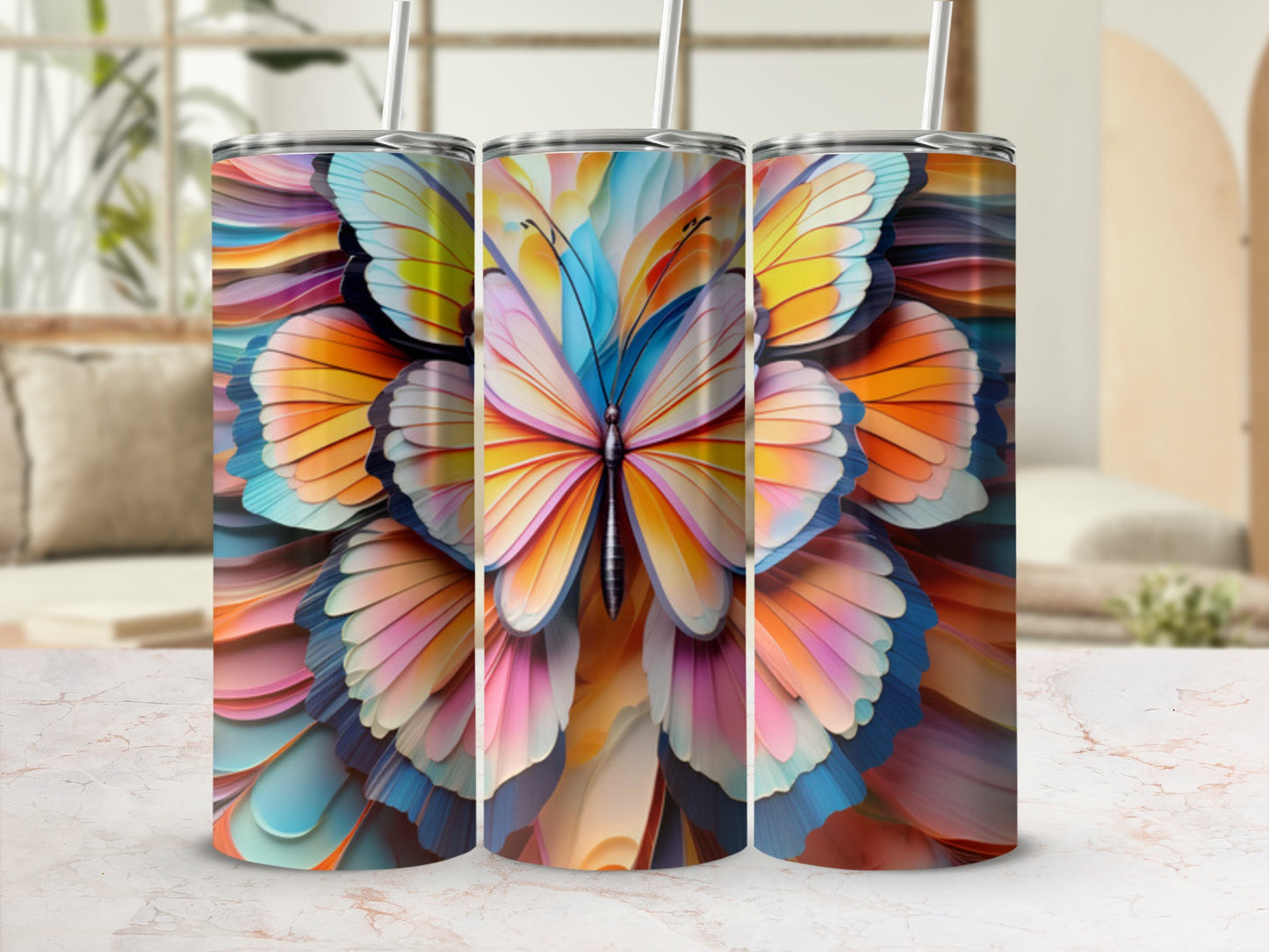 Three tumblers featuring a colorful, abstract butterfly design.