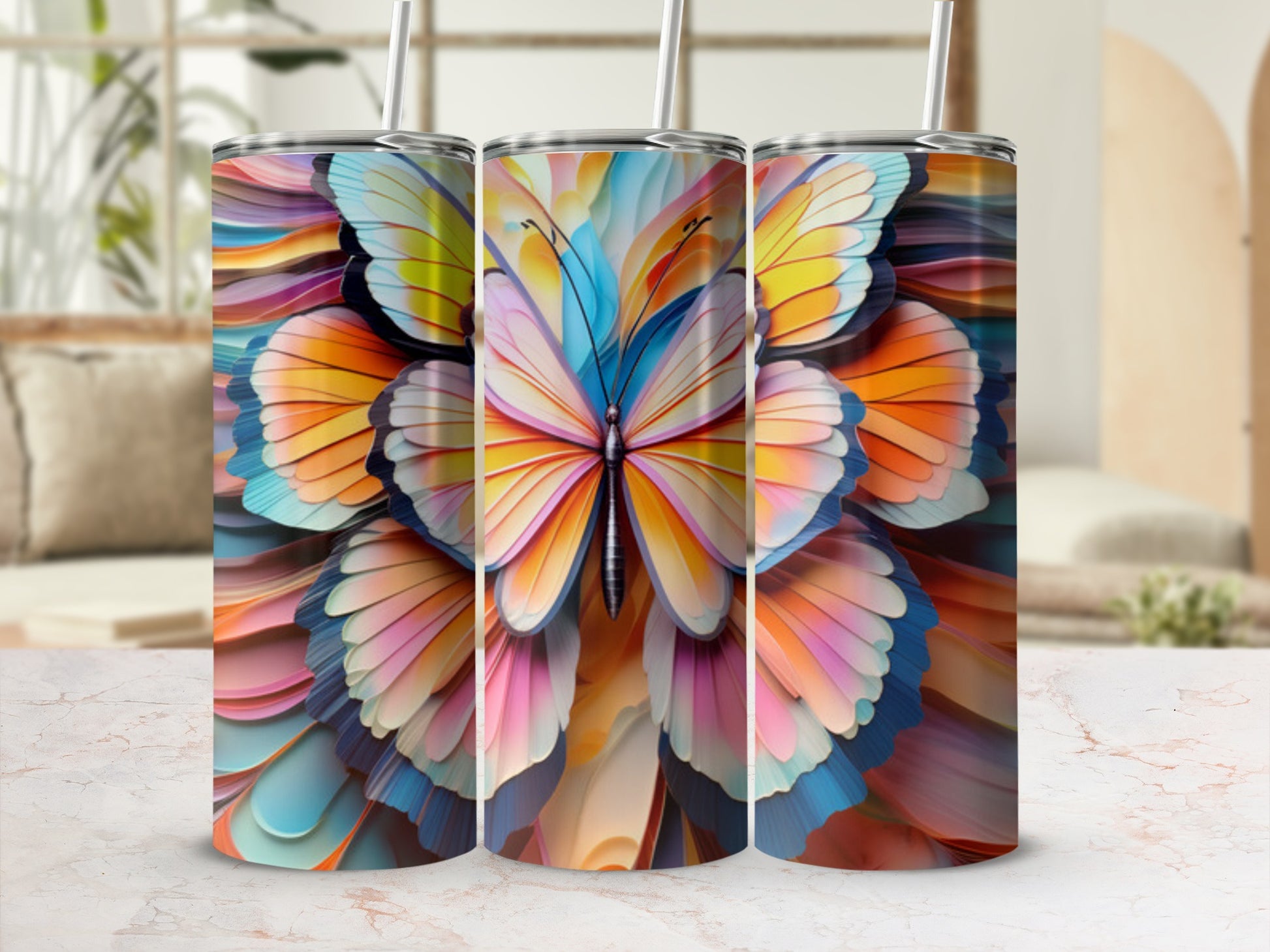 Three tumblers featuring a colorful, abstract butterfly design.
