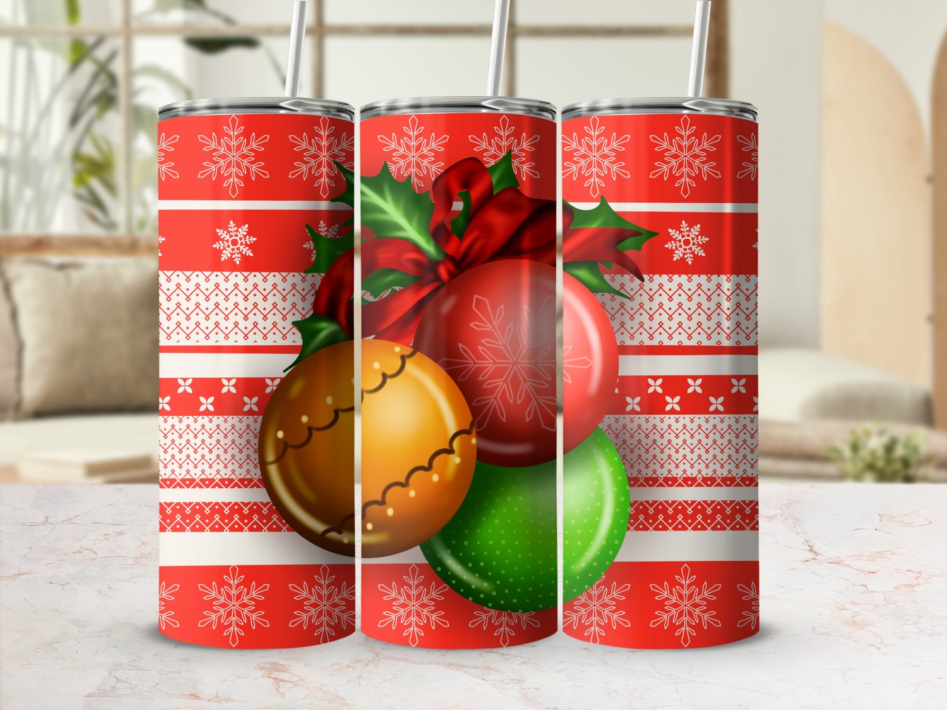 Three insulated tumblers with a red snowflake and geometric pattern.