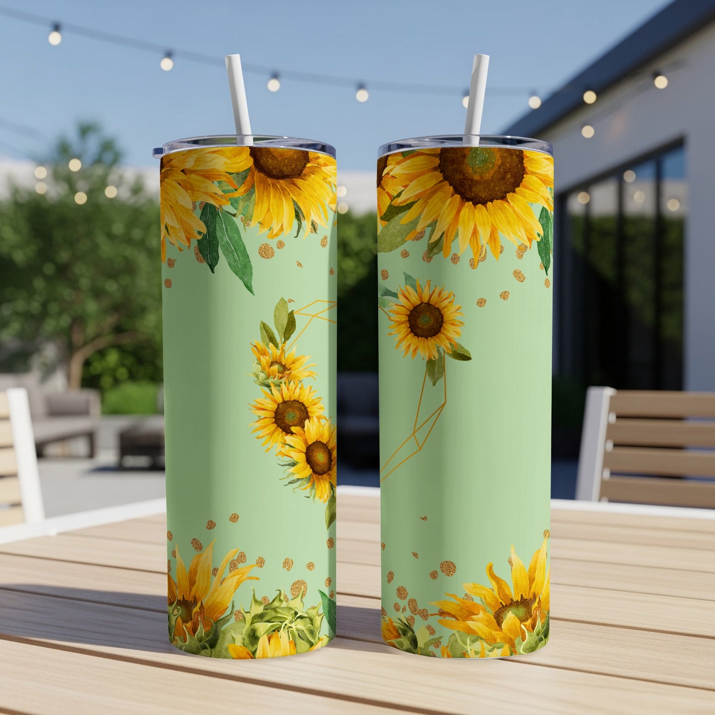 Two tall tumblers with a green background and a sunflower pattern.