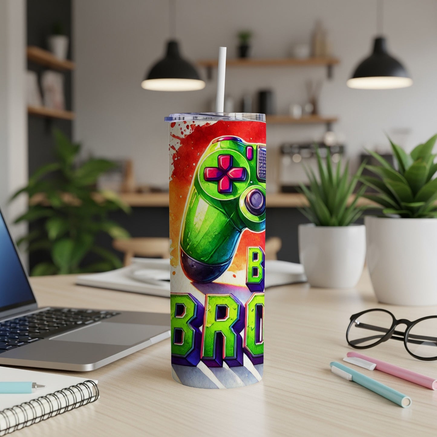 Green video game controller with "BRO" in graffiti lettering on a white tumbler.