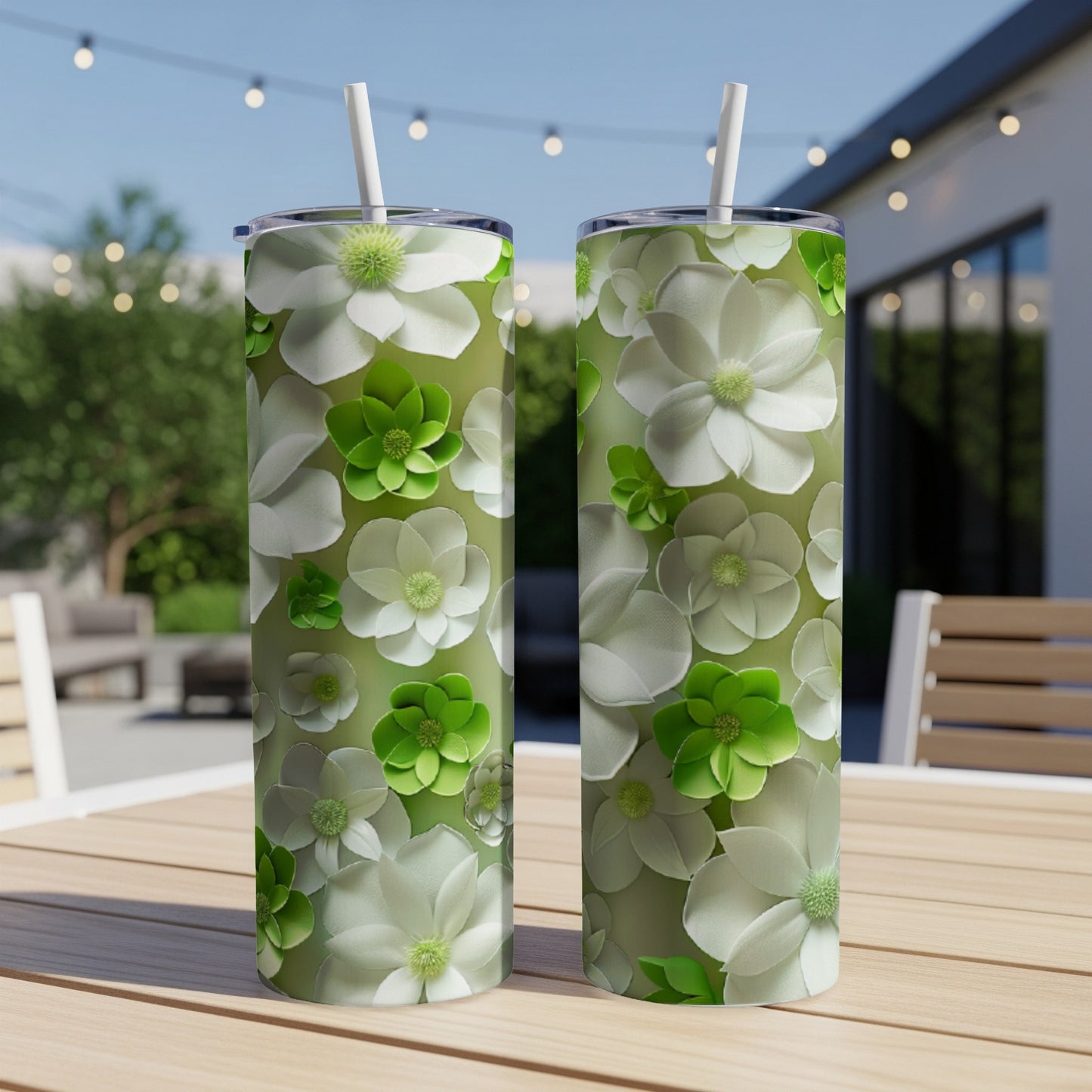 Two tumblers with a floral pattern of white and green flowers.