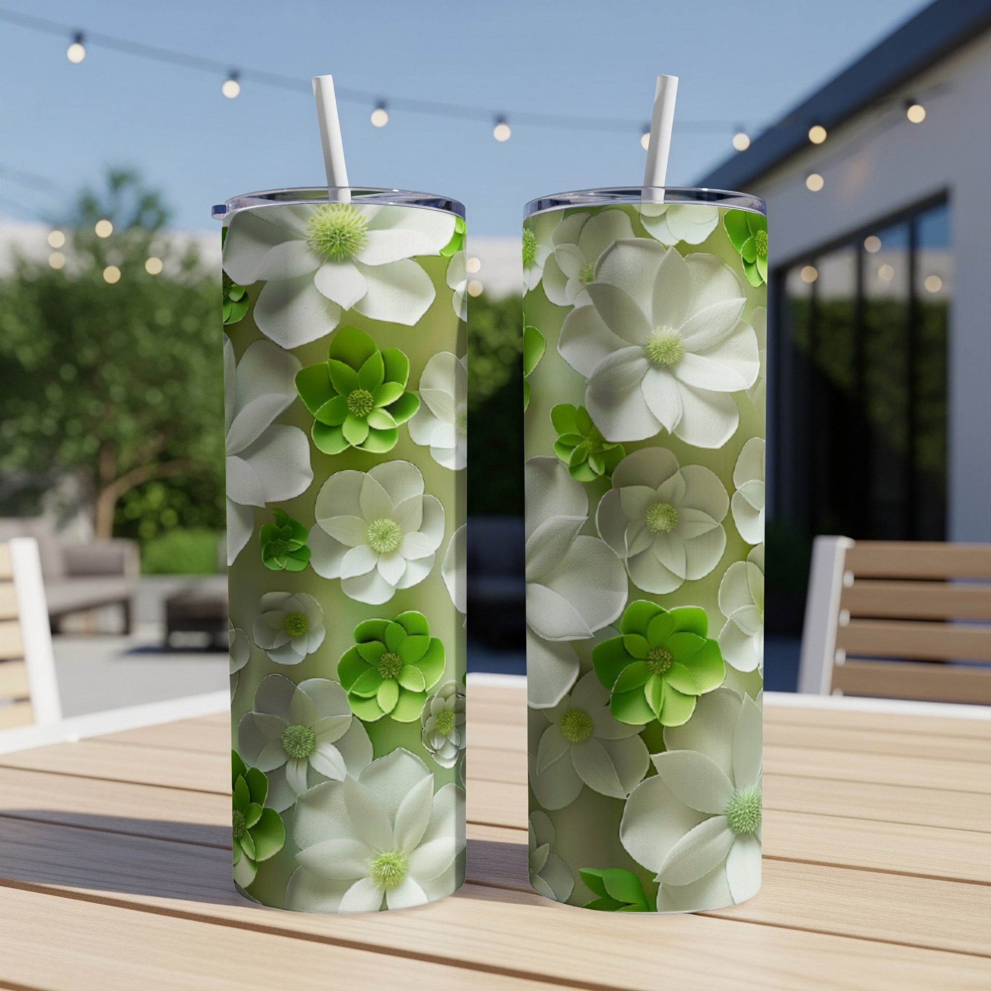 Two tumblers with a floral pattern of white and green flowers.