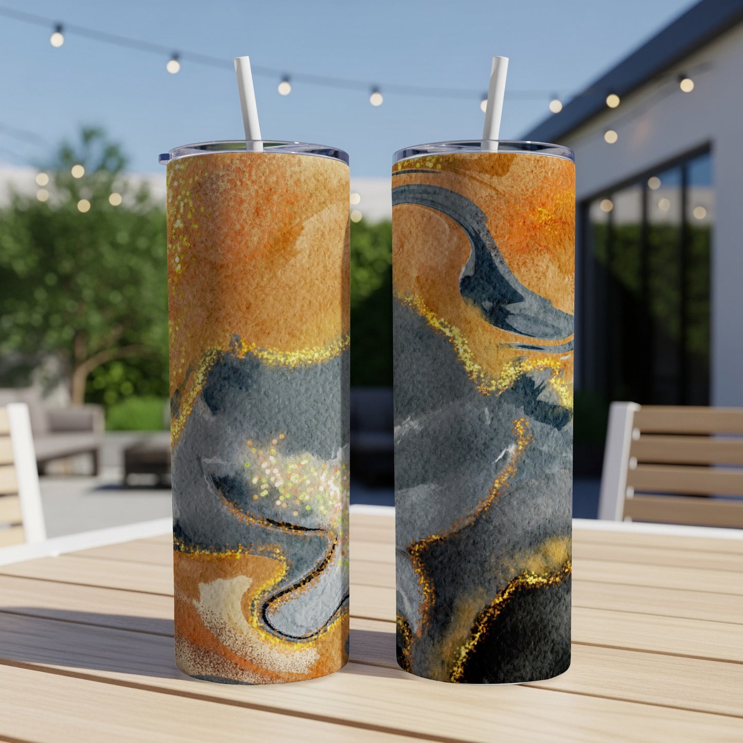 Two tumblers with marbled orange, gold, and gray abstract design.
