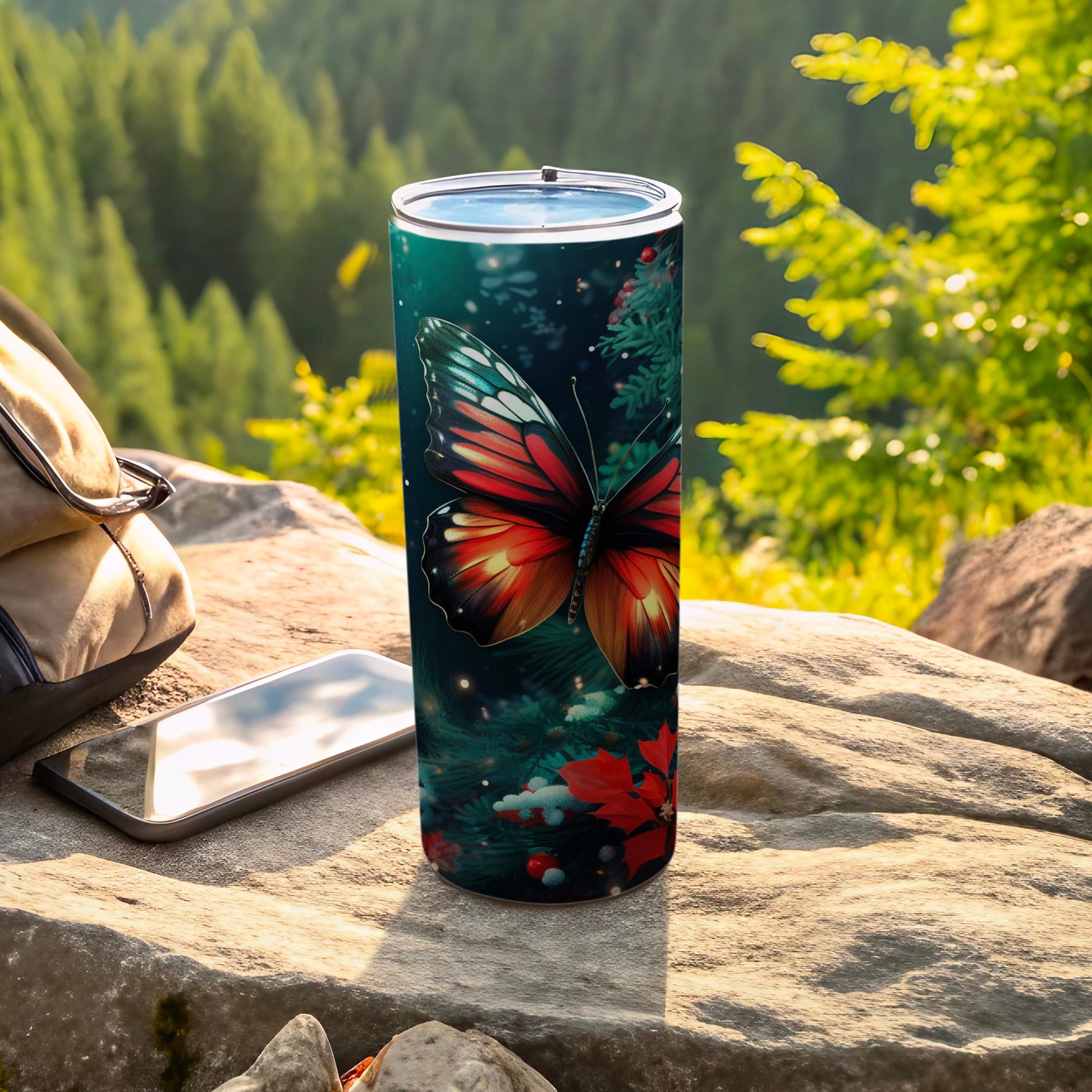 Tall tumbler with a monarch butterfly and poinsettias design.