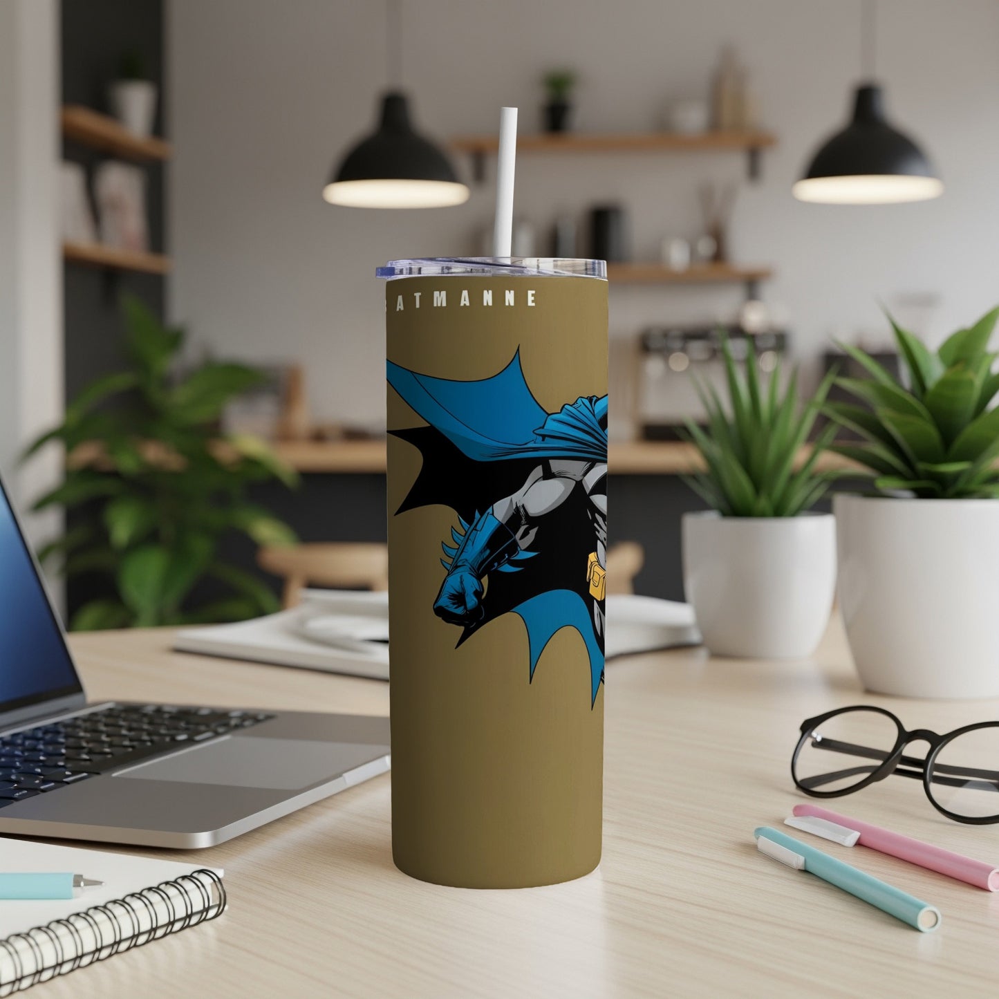 Gold tumbler with Batman graphic and "BATMAN" text.