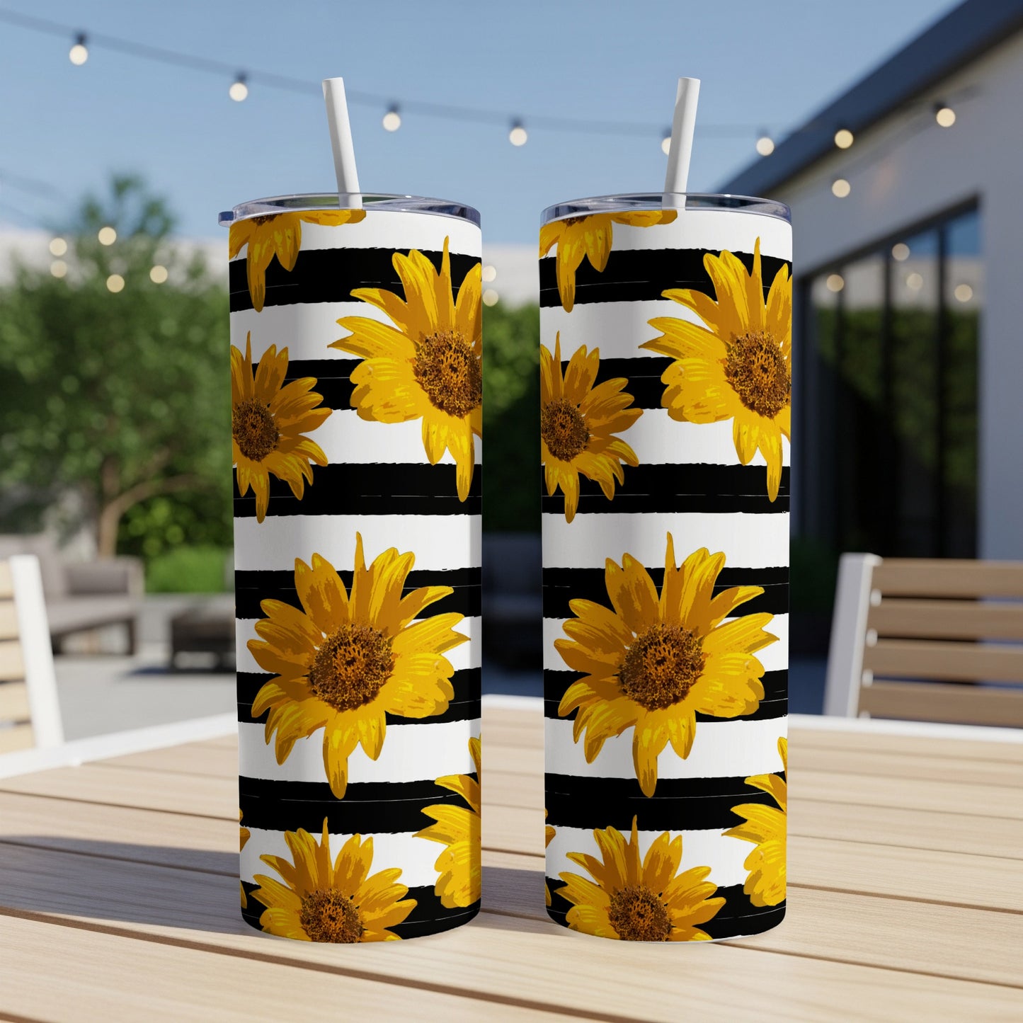 Two tumblers with black and white stripes and sunflower pattern.