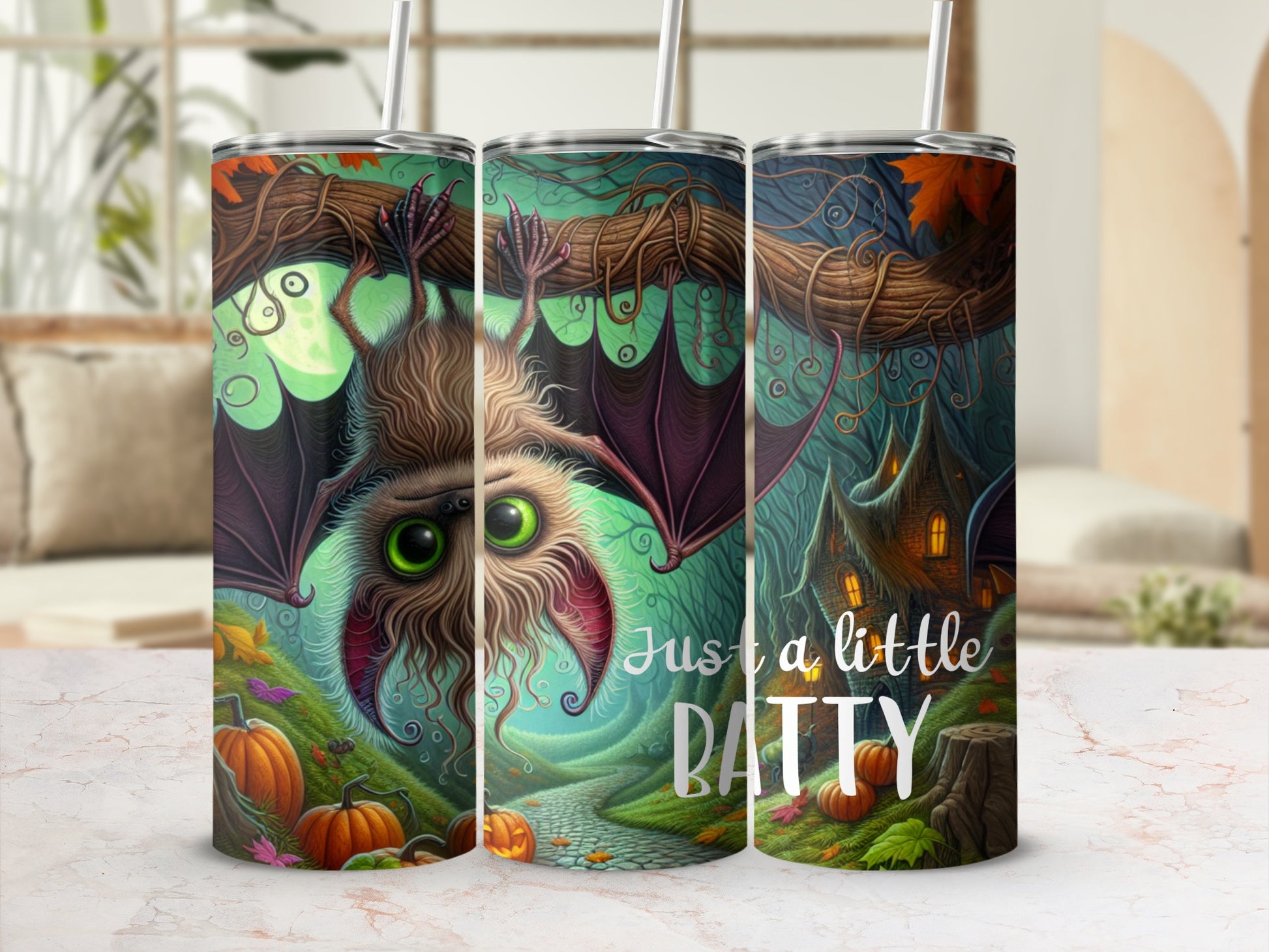 Three tumblers with a Halloween theme featuring a bat, pumpkins, and a spooky house.