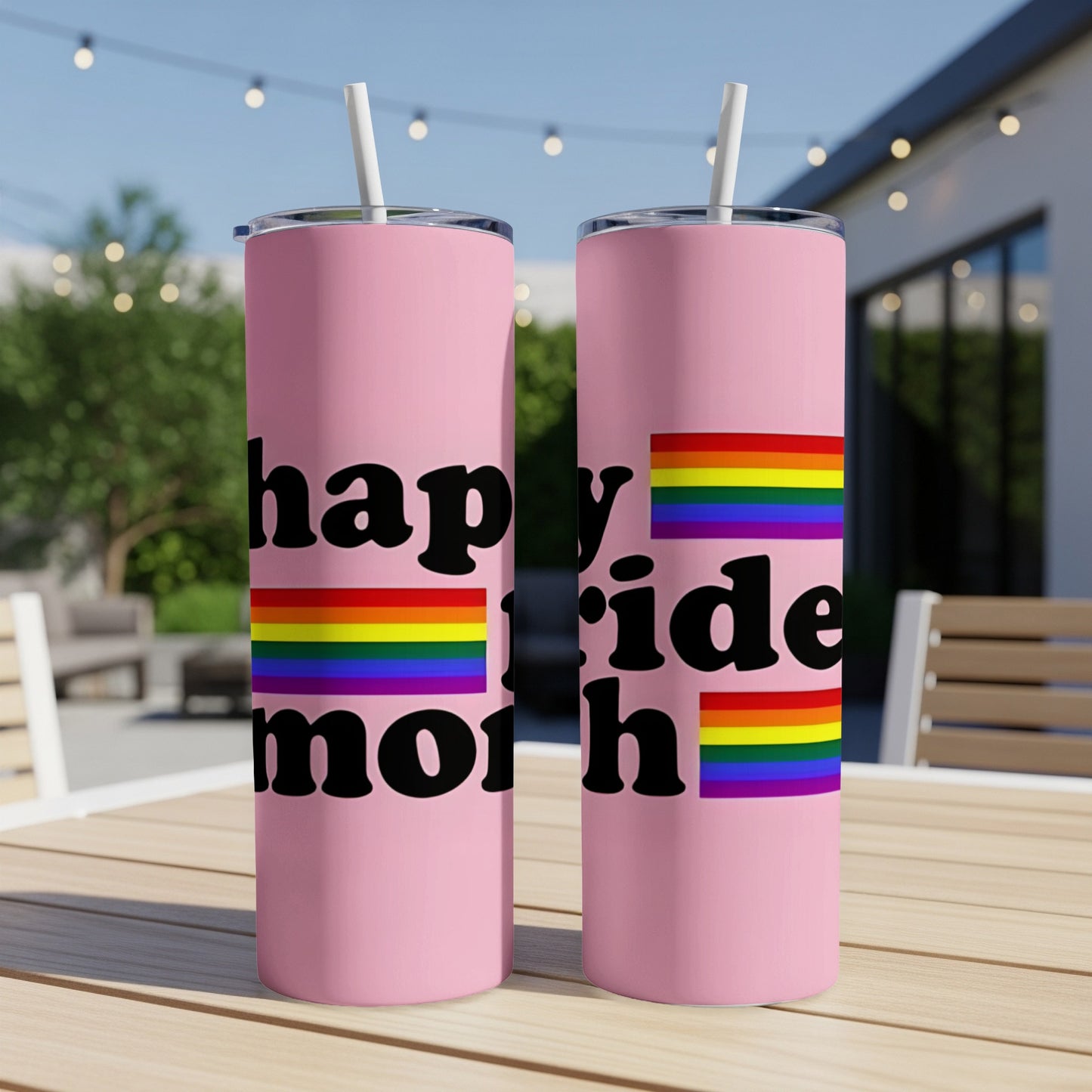 Two pink tumblers with "happy pride month" text and rainbow flag stripes.