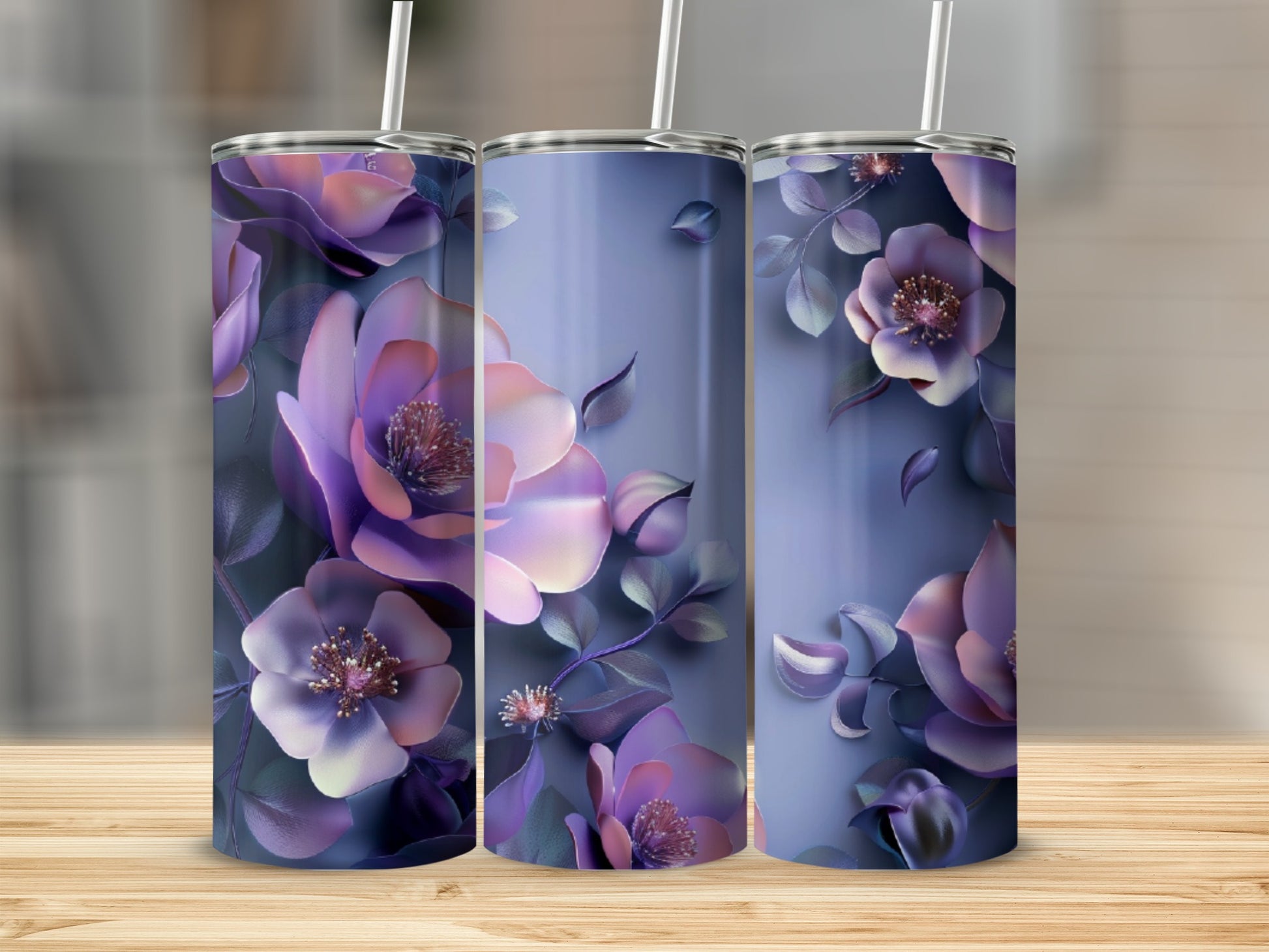Purple floral design on three tumblers, one at center, two flanking.