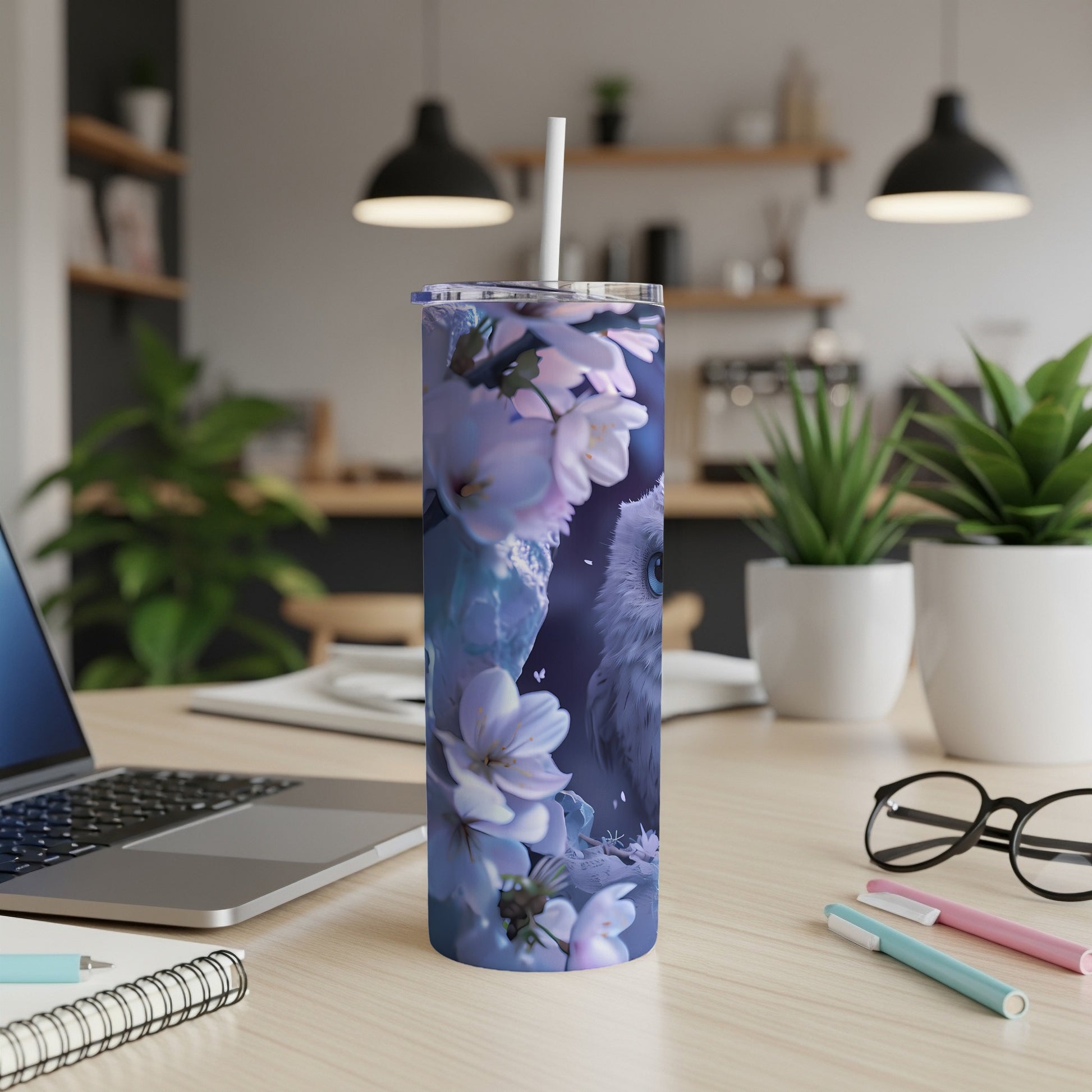 Blue owl and cherry blossoms on a white skinny tumbler.