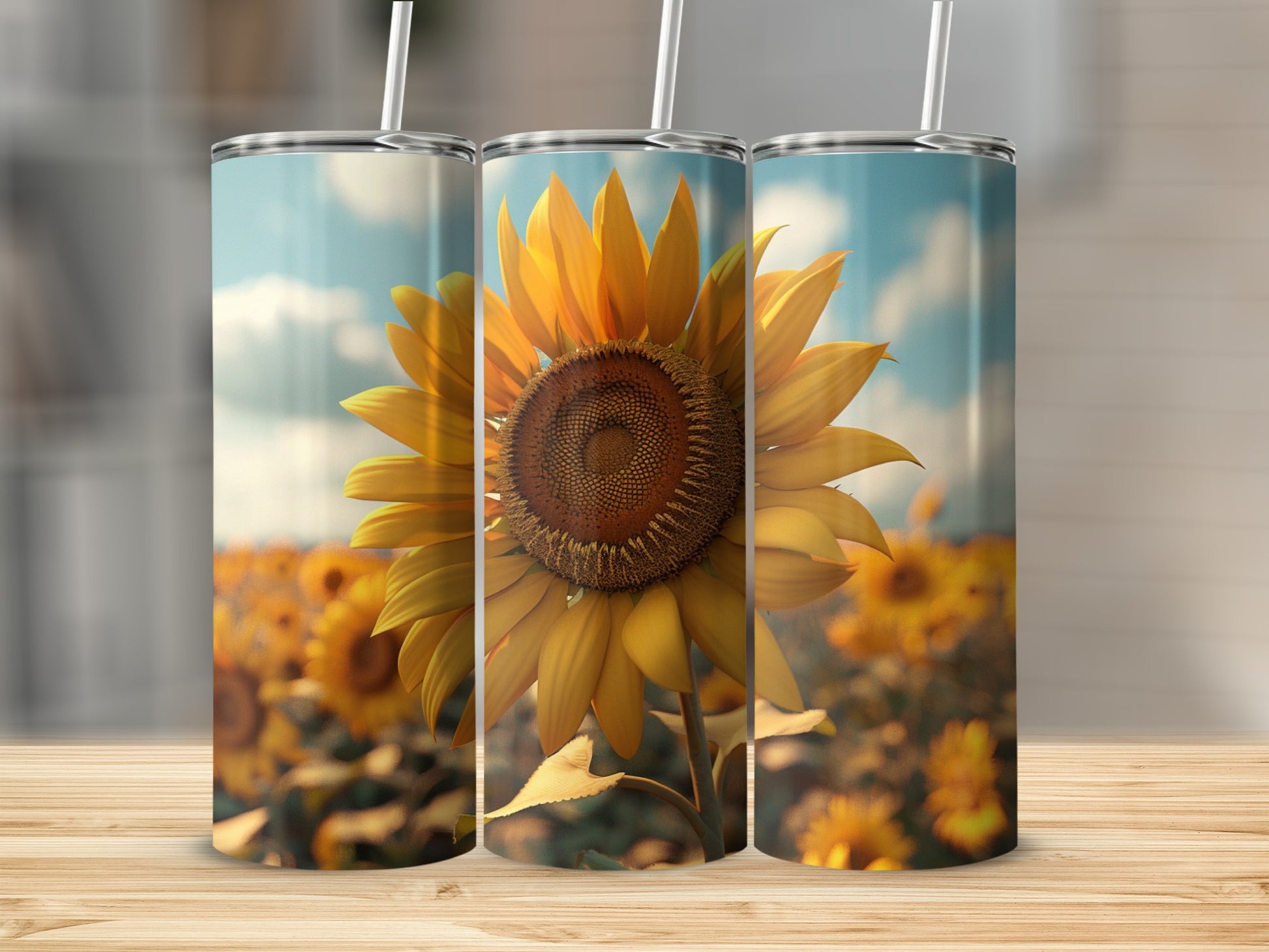 Three tall tumblers featuring a close-up sunflower against a blurred field.