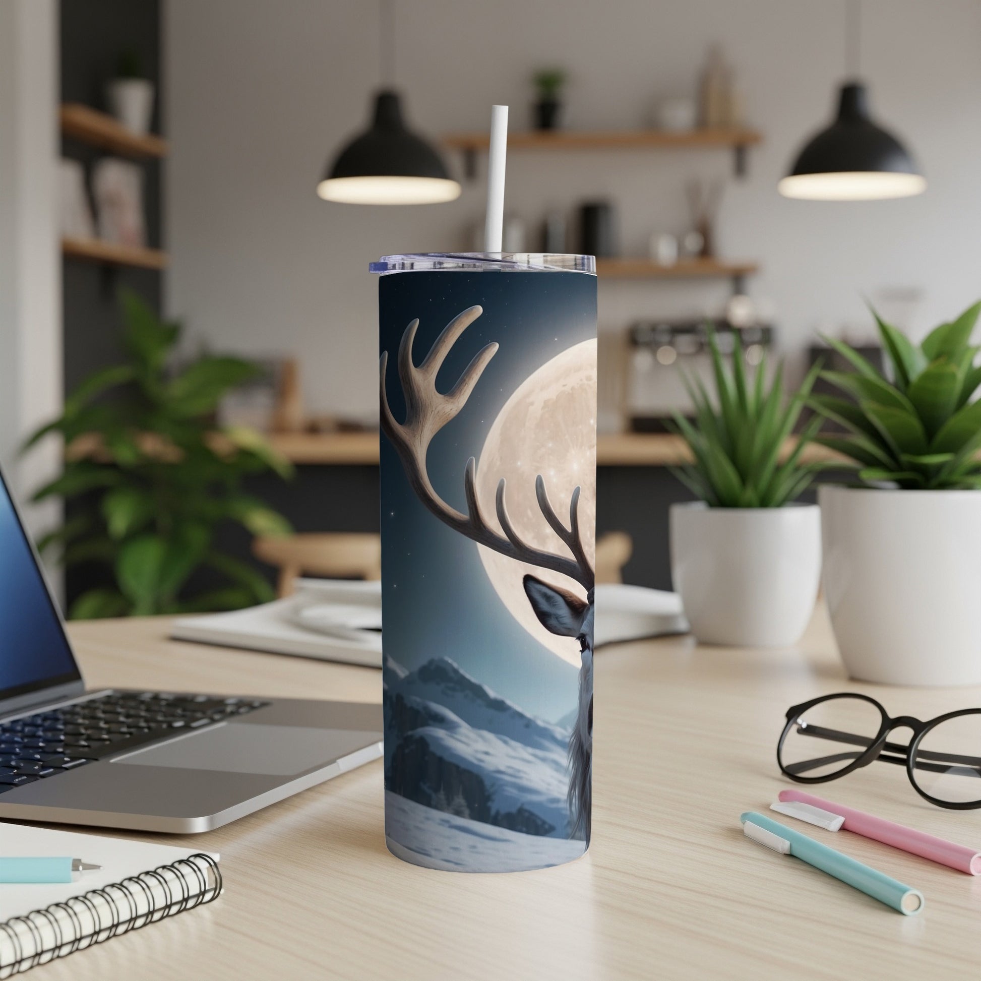 Reindeer and moon on a festive tumbler with a straw.