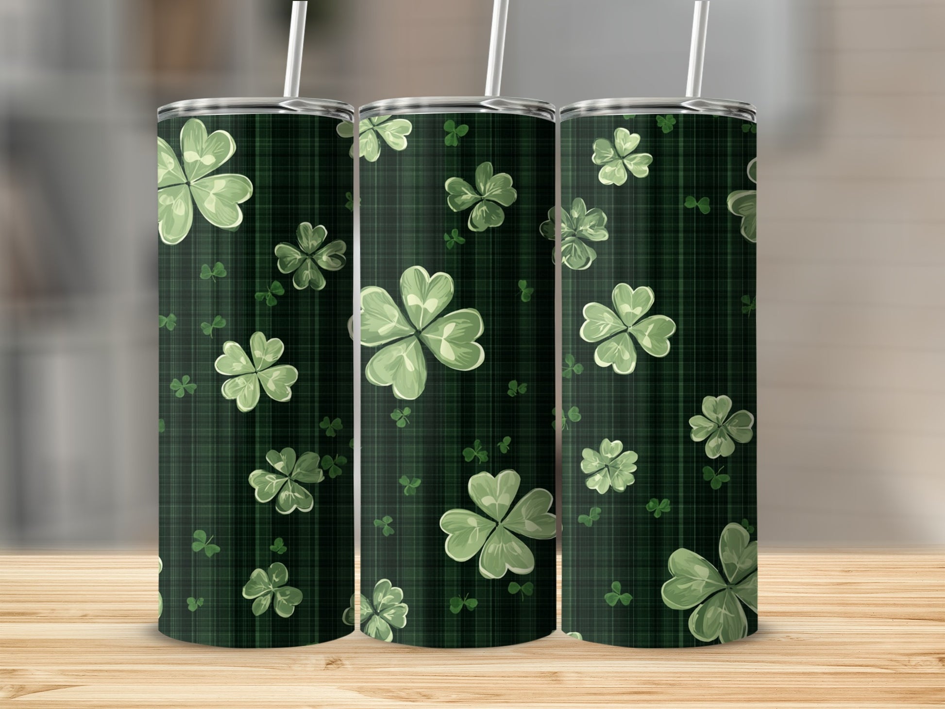 Three green plaid tumblers with clover leaf pattern.