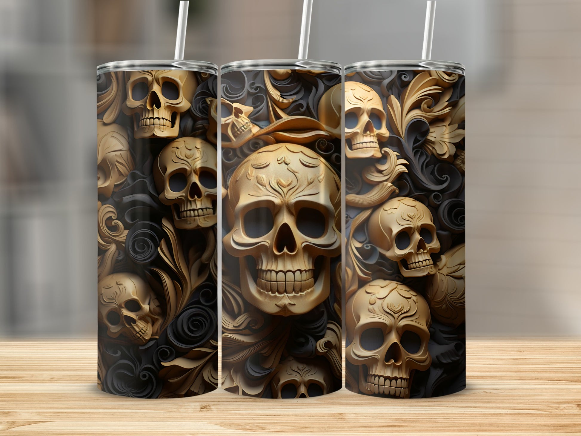Gold skulls and ornate scrollwork pattern on three tumblers.