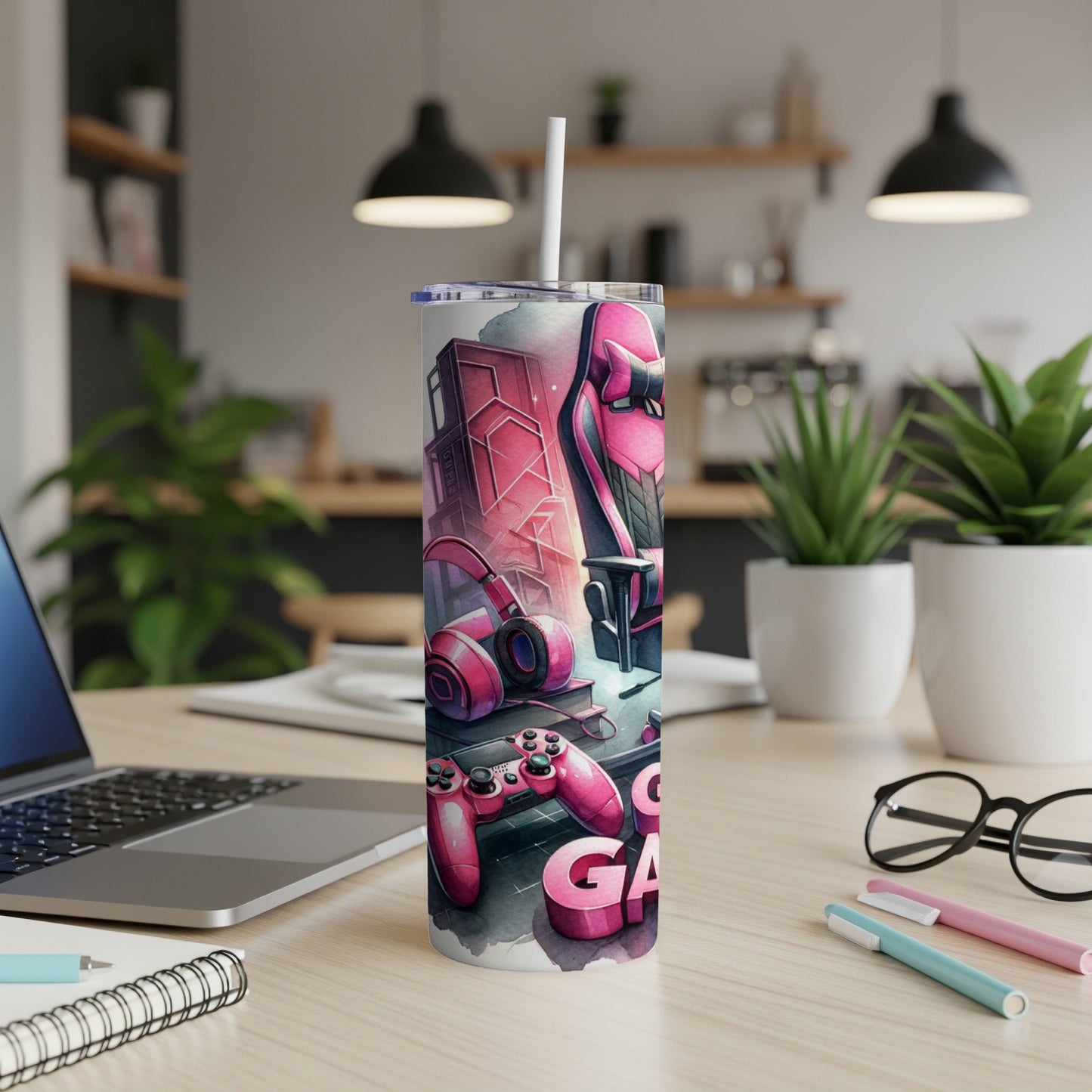 Pink gaming-themed tumbler with headphones, controller, and "GAMING" text.