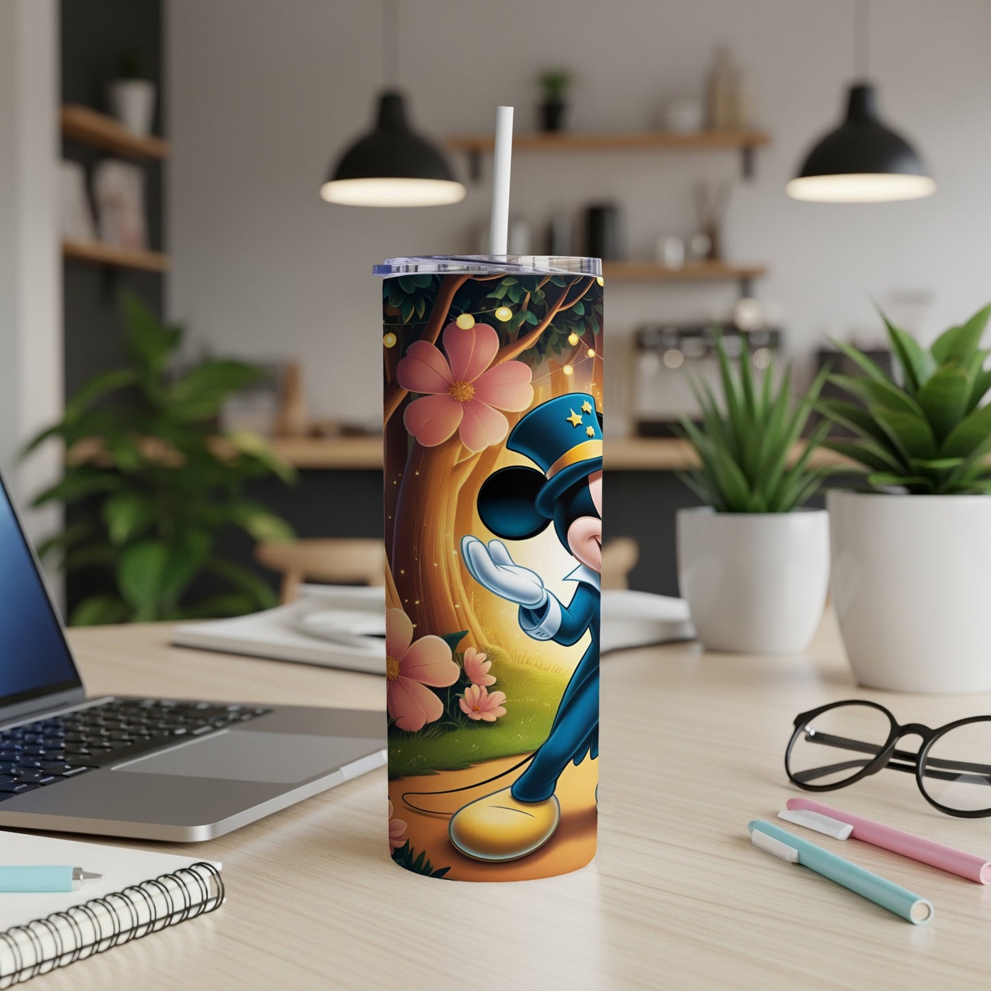 Mickey Mouse in a blue magician's outfit on a tumbler with floral and starry background.