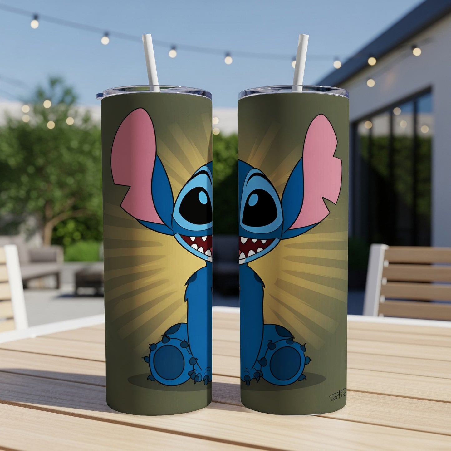 Cartoon Stitch character on two identical tumblers with straws, displayed outdoors.