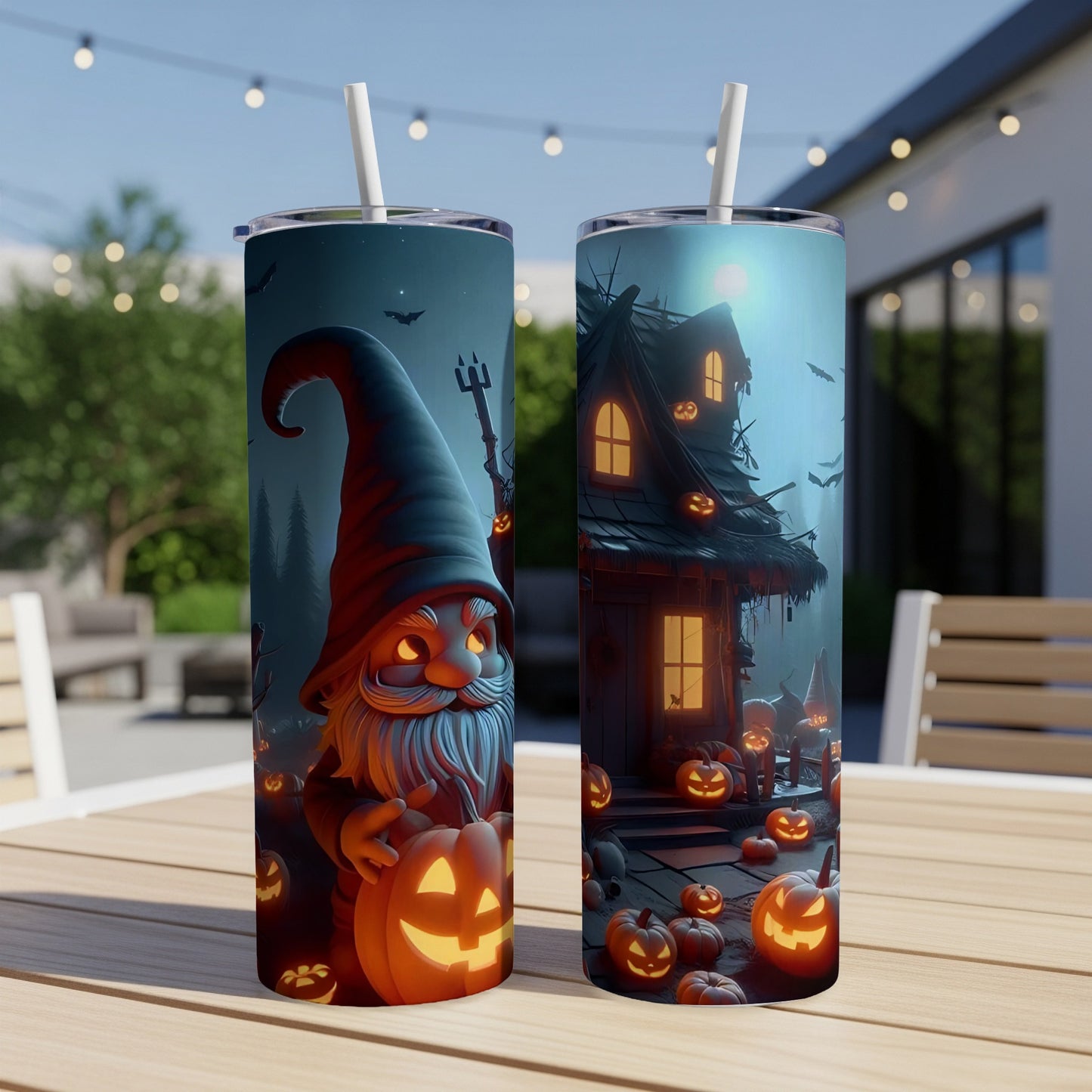 Two tumblers with Halloween gnome and haunted house designs with pumpkins.