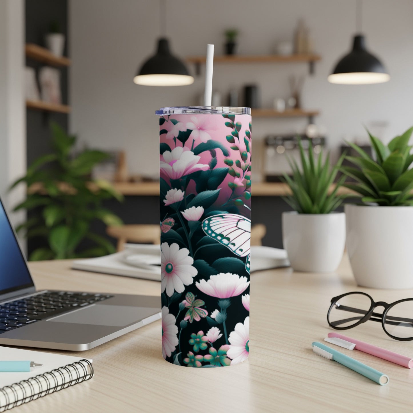 Pink and green floral pattern with a butterfly on a tumbler.