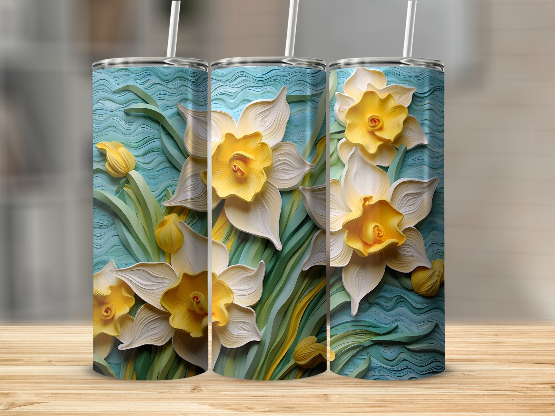 Three tall tumblers with a 3D embossed daffodil floral design.