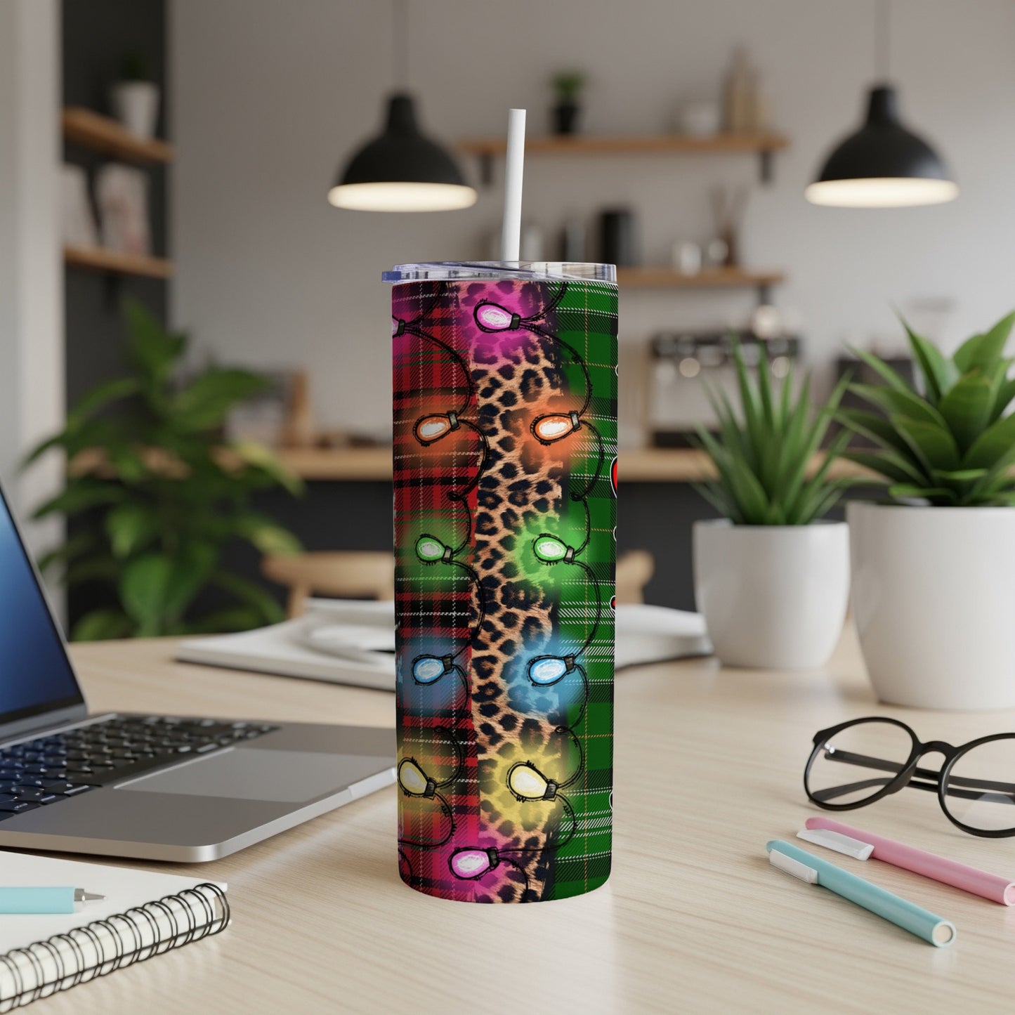 Green, red, and black plaid tumbler with colorful Christmas lights and leopard print.