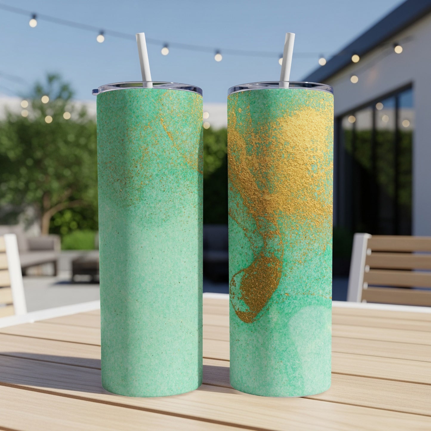 Two tall, slender tumblers with a green and gold abstract speckled design.
