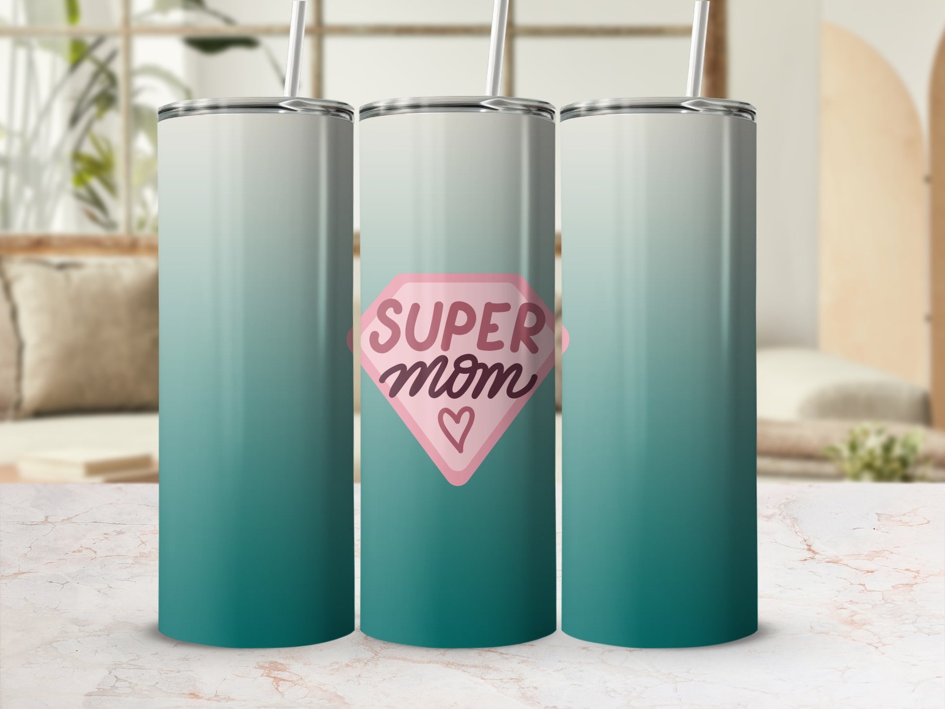 Teal gradient tumbler with pink "Super Mom" heart graphic.