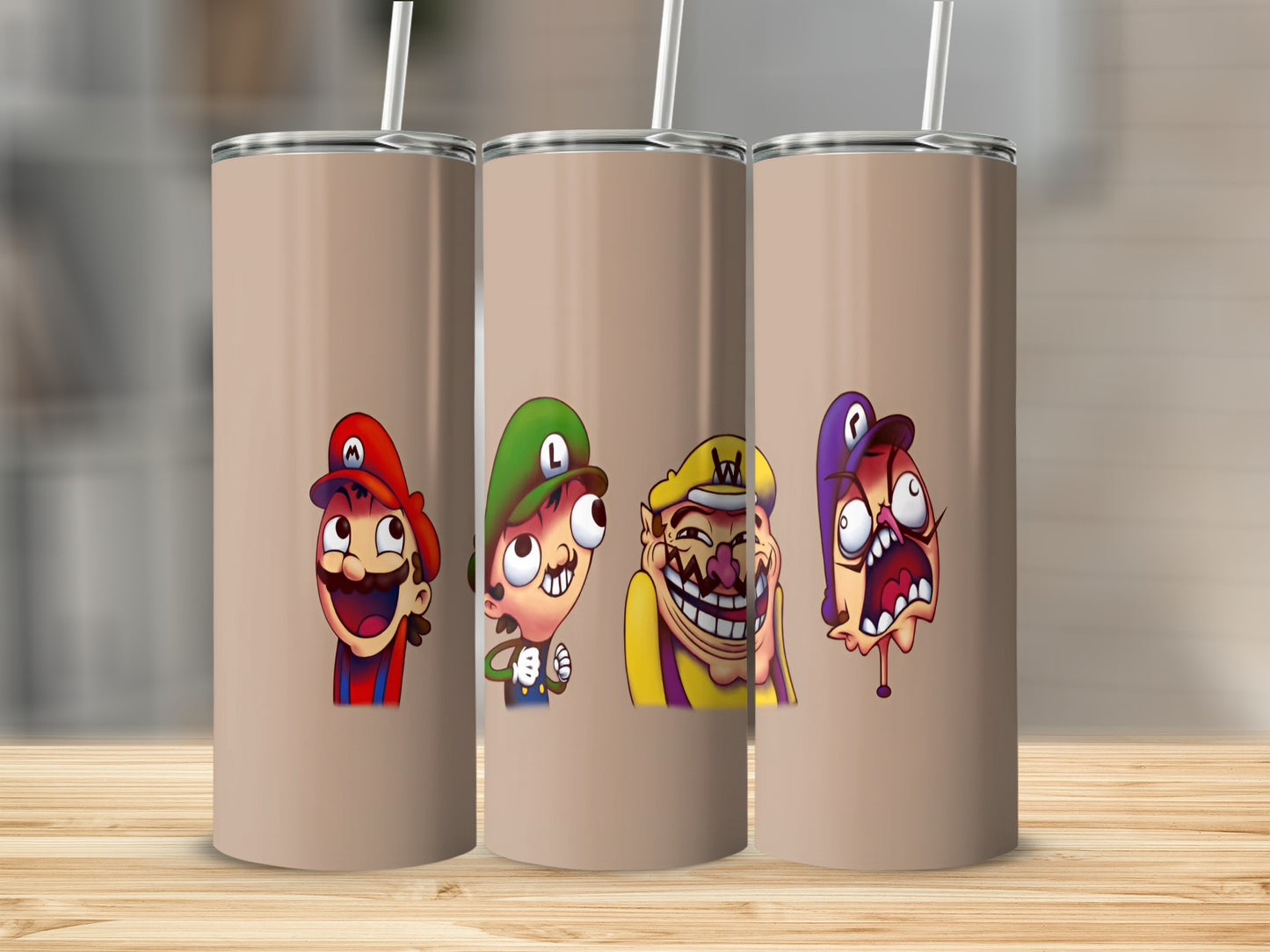 Three cartoon characters with exaggerated expressions on a tan tumbler.