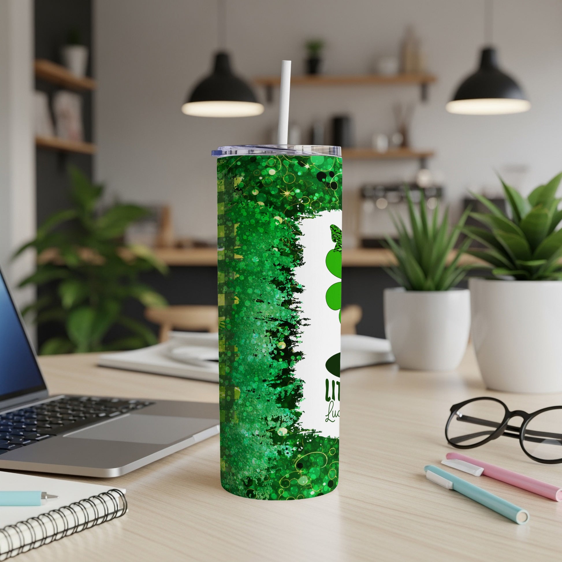 Green sparkly tumbler with "Little bit lucky" text and shamrocks.