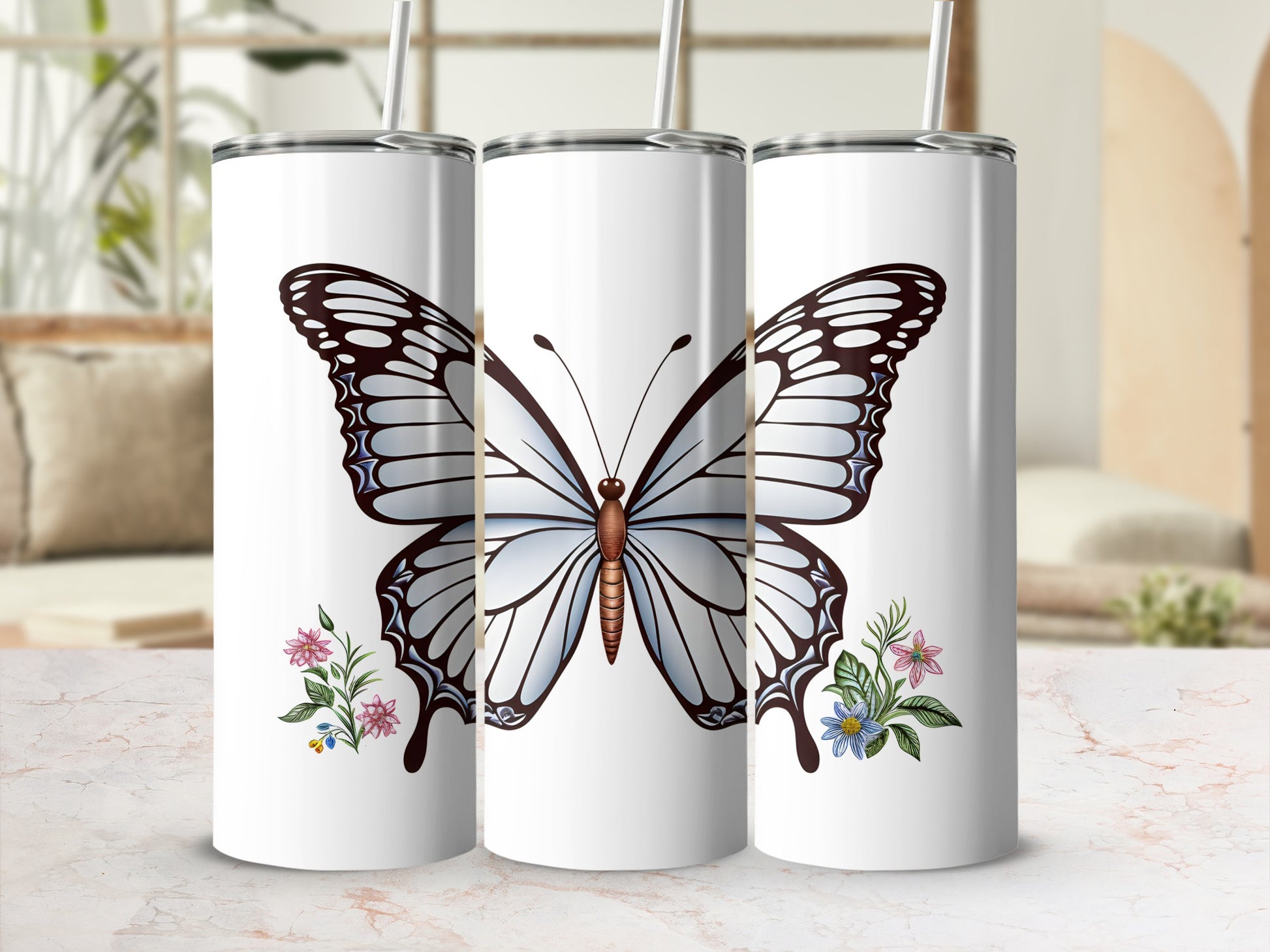 White tumbler with large butterfly and floral designs.
