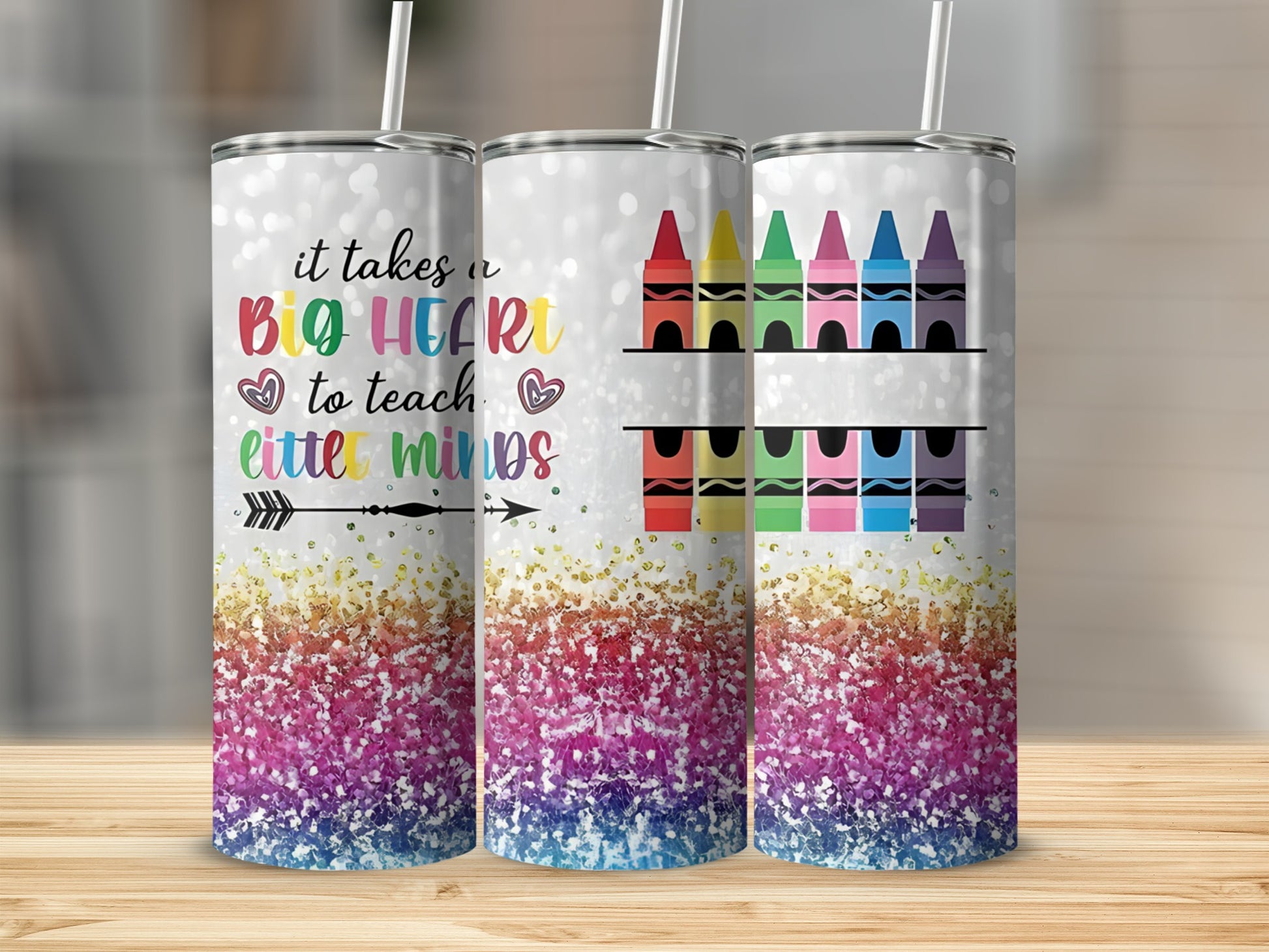 Glitter tumbler with "It takes a big heart to teach little minds" and crayons.