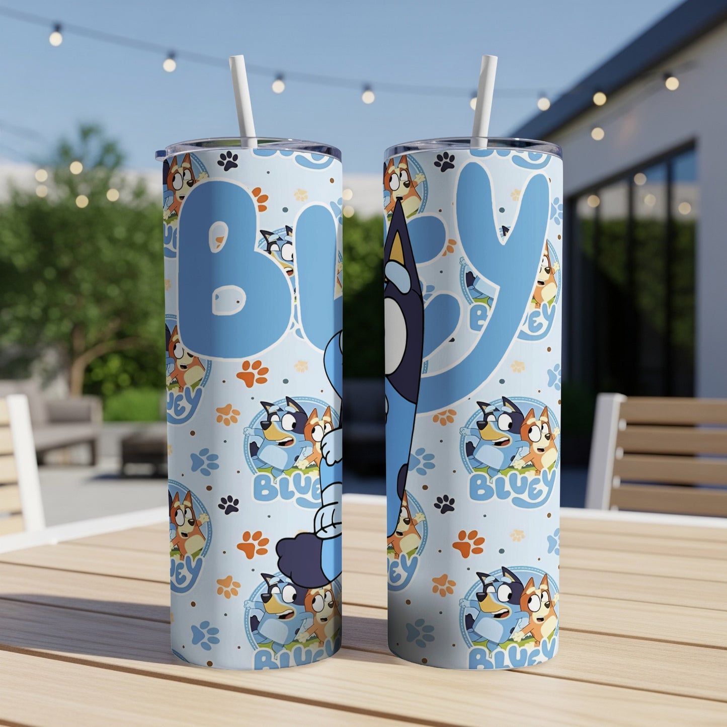 Bluey characters and paw prints on a light blue patterned tumbler with straw.