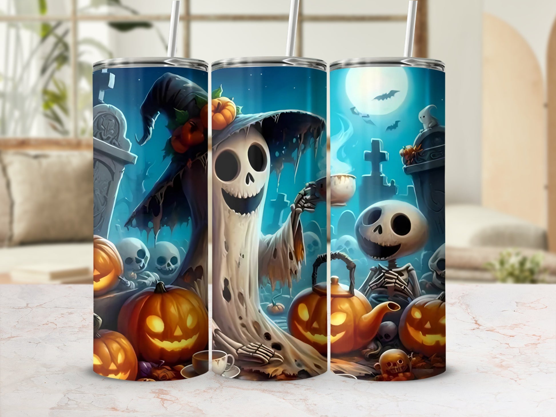 Three tumblers with Halloween ghosts, skeletons, pumpkins, and gravestones on a dark blue background.