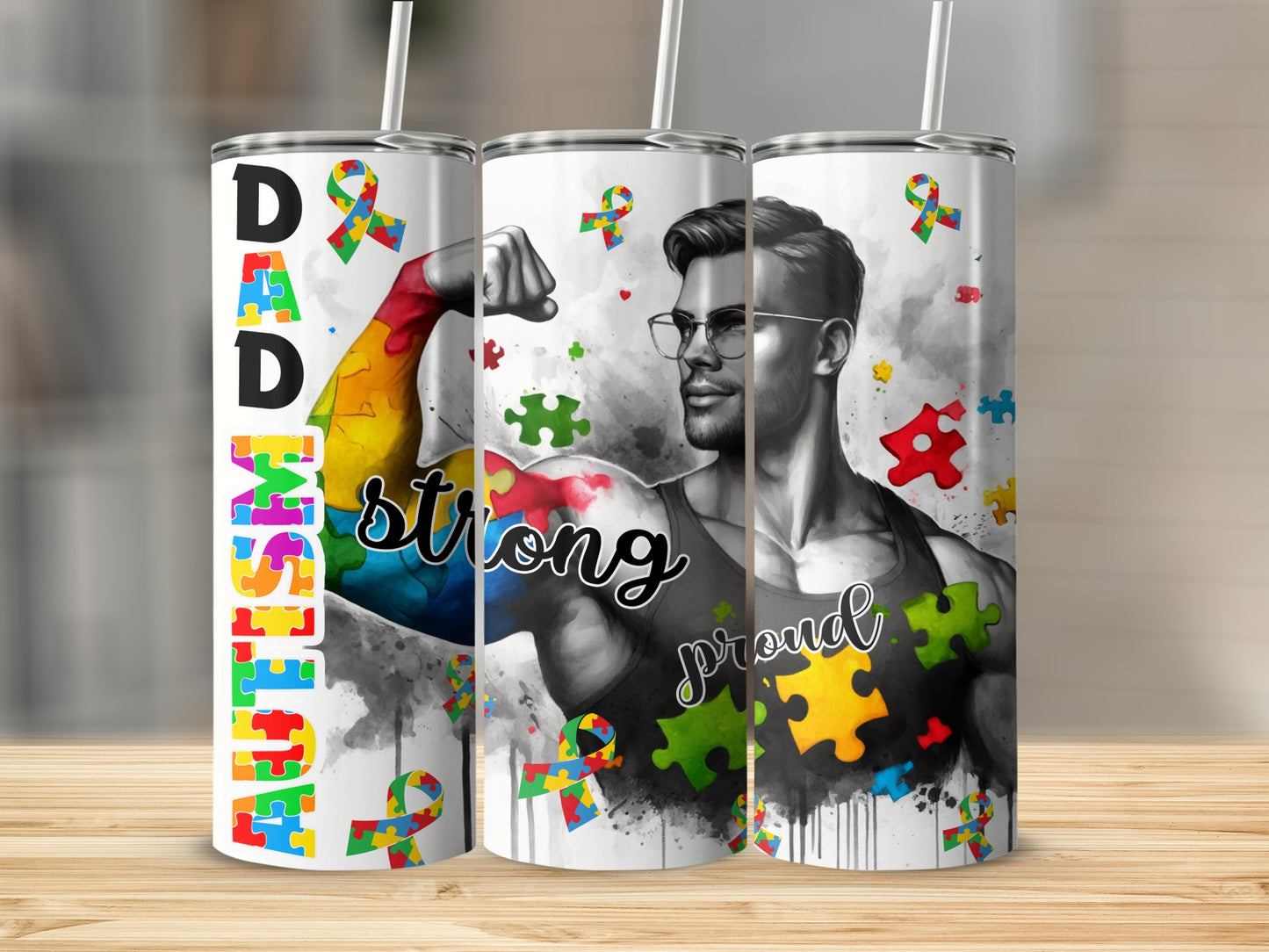 Tumbler with "Dad Strong" text and colorful autism puzzle pieces.