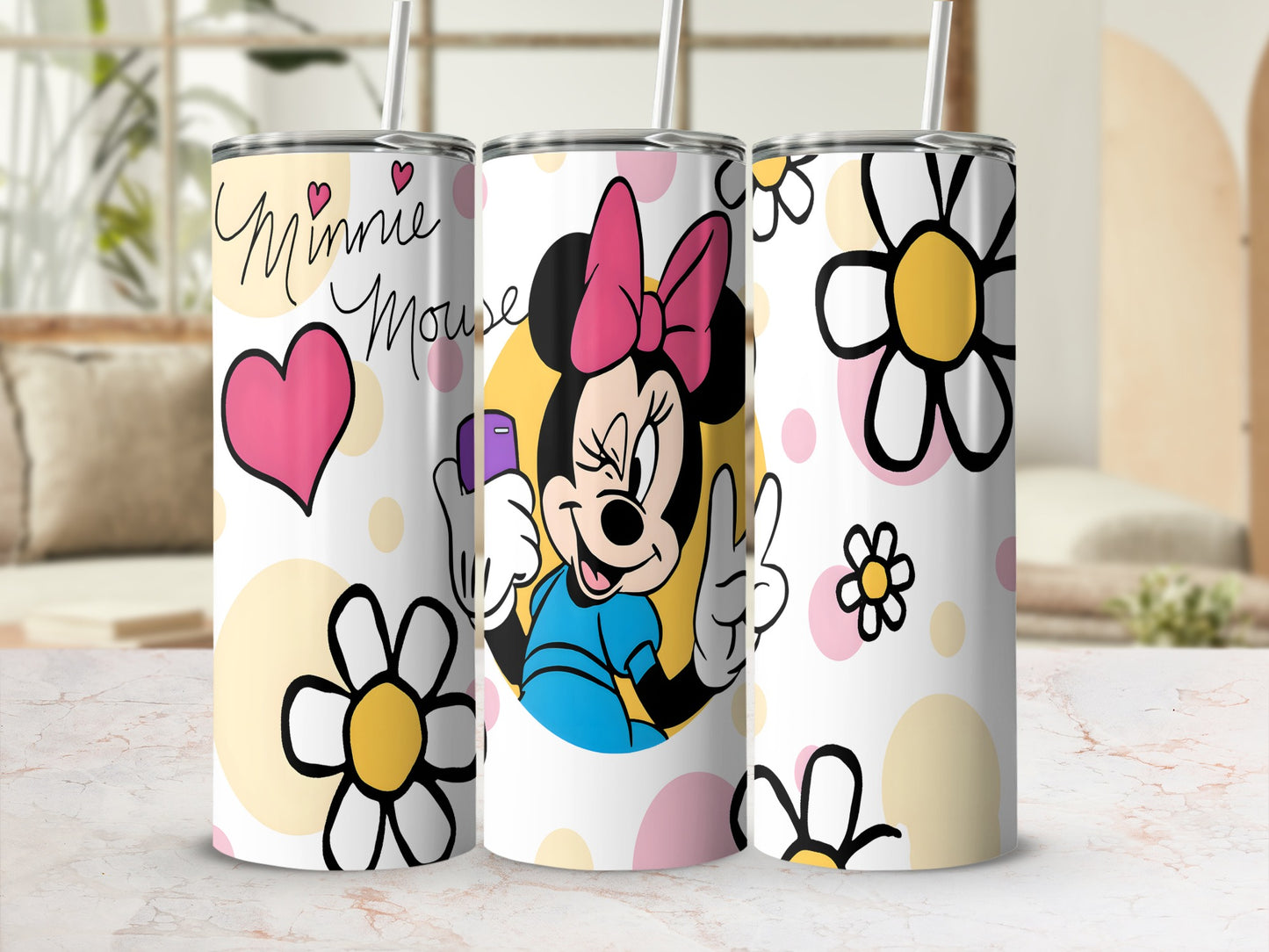 Minnie Mouse holding a pink heart and flowers on a white tumbler.